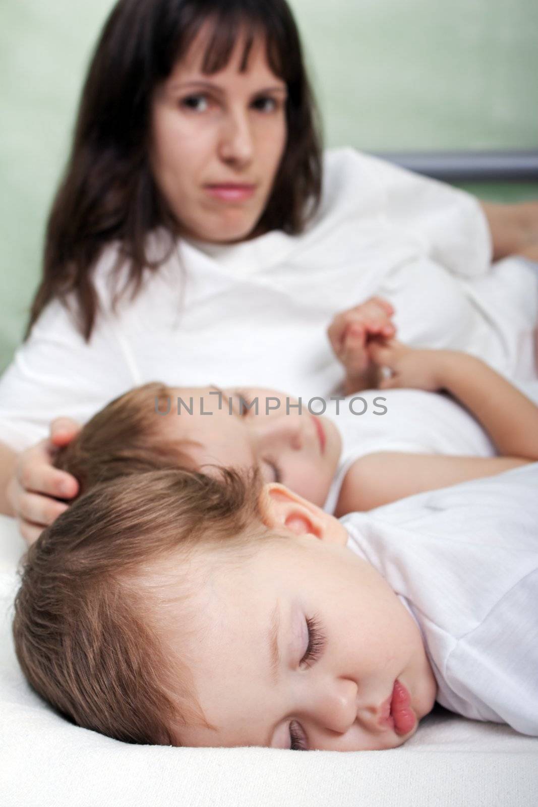 Mother and sleeping cute child in family love life