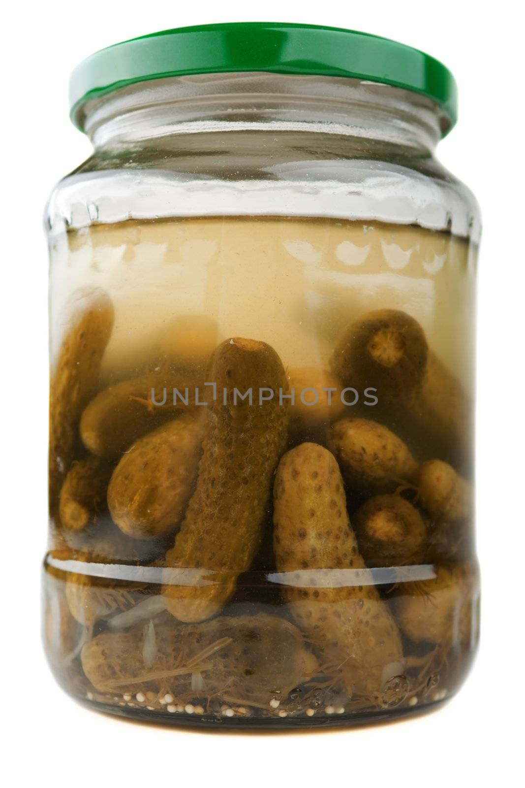 Green pickled cucumber vegetable food in glass jar