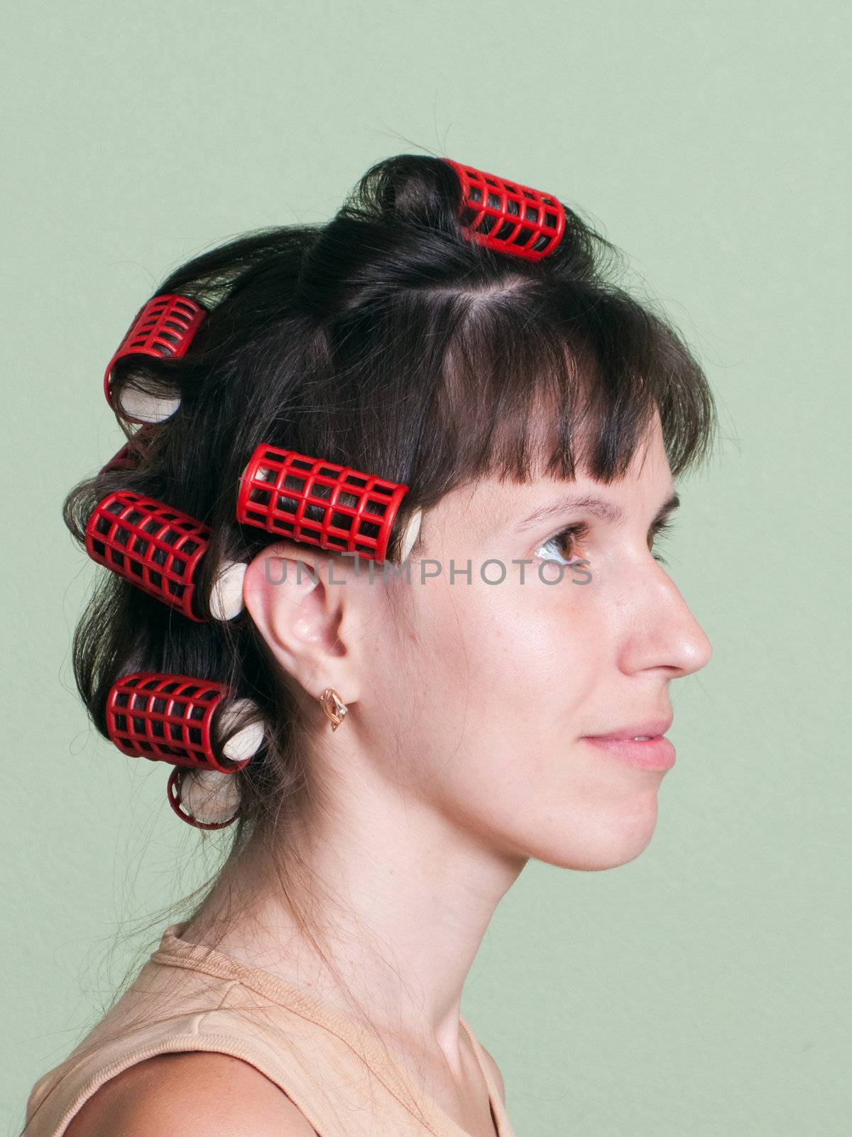 Curlers hair roller on adult beauty women