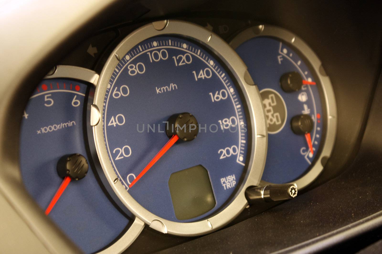 Driving speed speedometer gauge on car dashboard