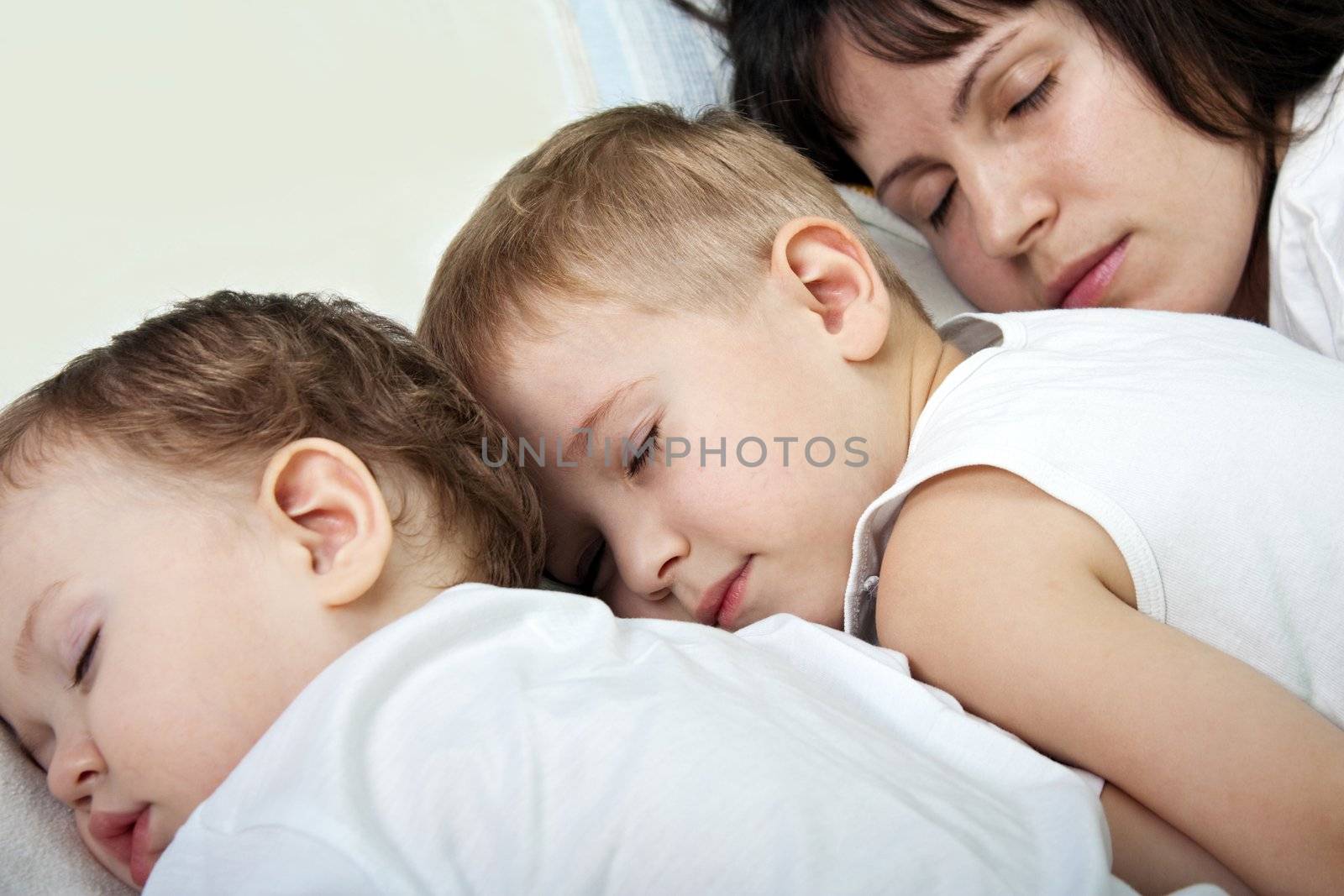 Sleeping mother and cute child in family love life