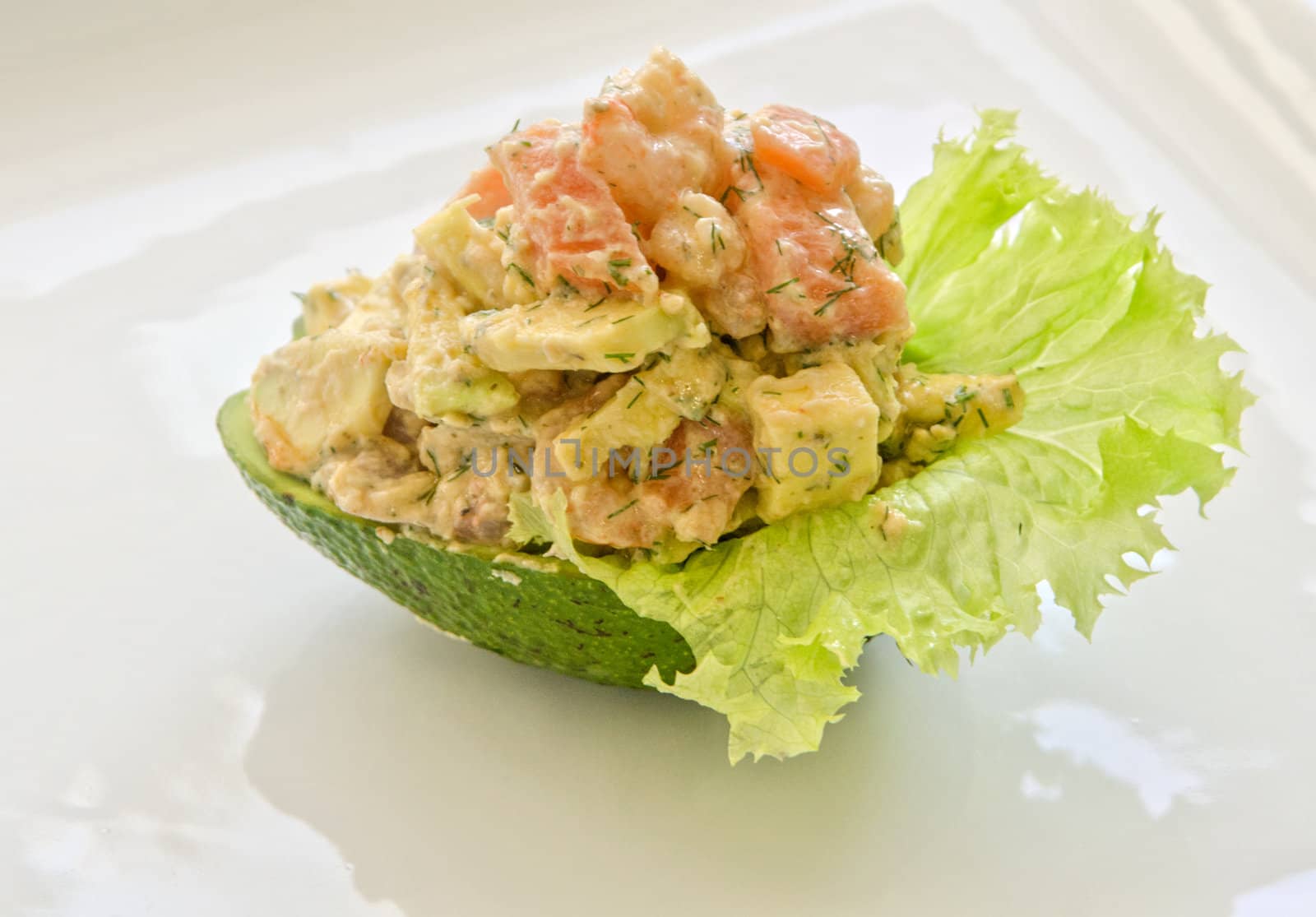 Fresh salad with shrimps, salmon and avocado