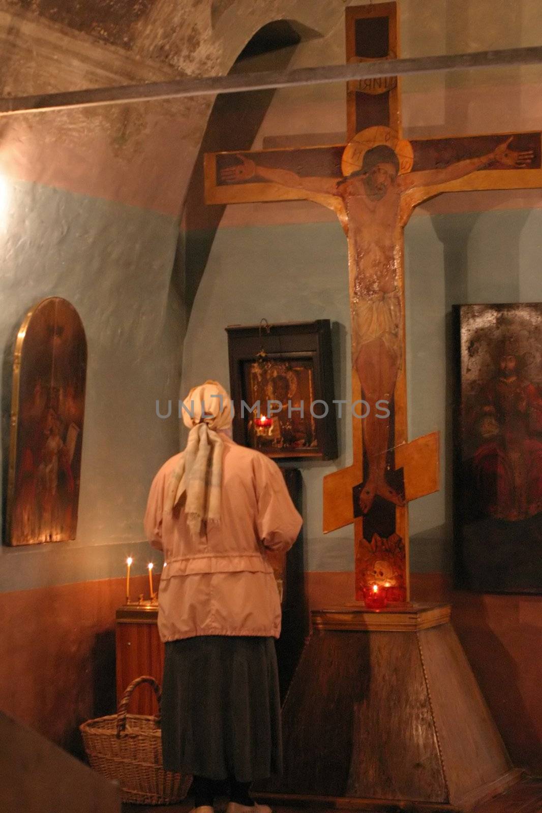 Pray god at crucifix in a church religion scene by ia_64