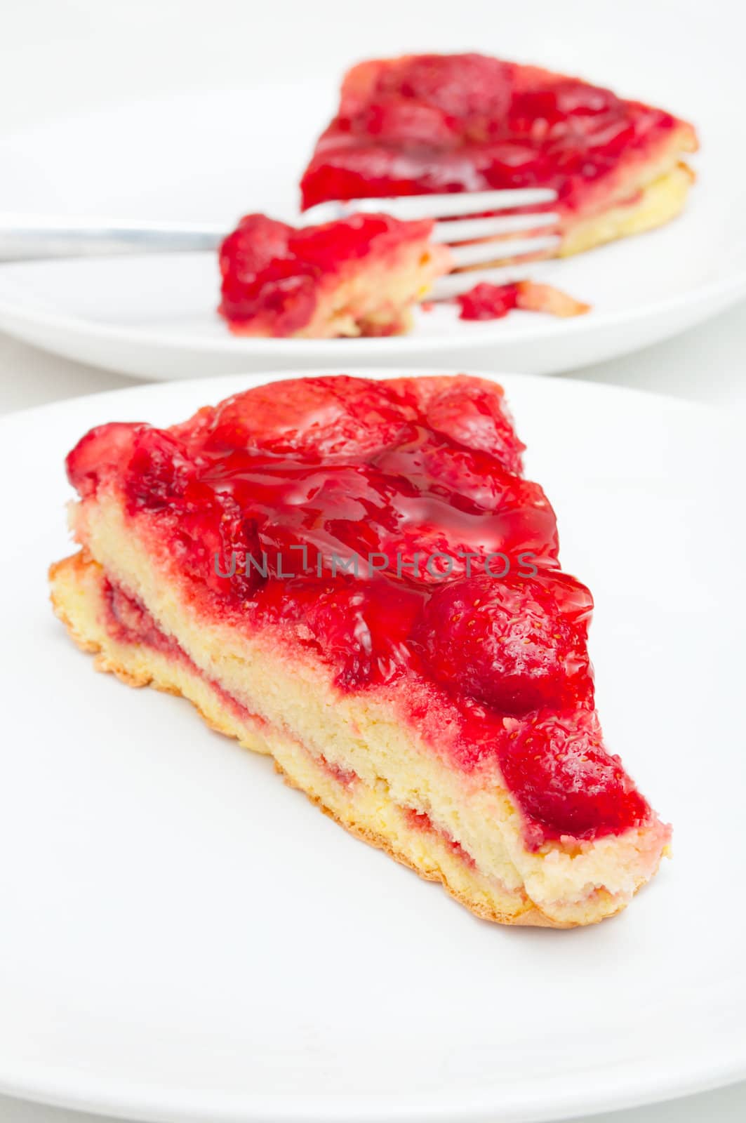 Slices of Homemade Strawberry Pie With Jelly on White Plate