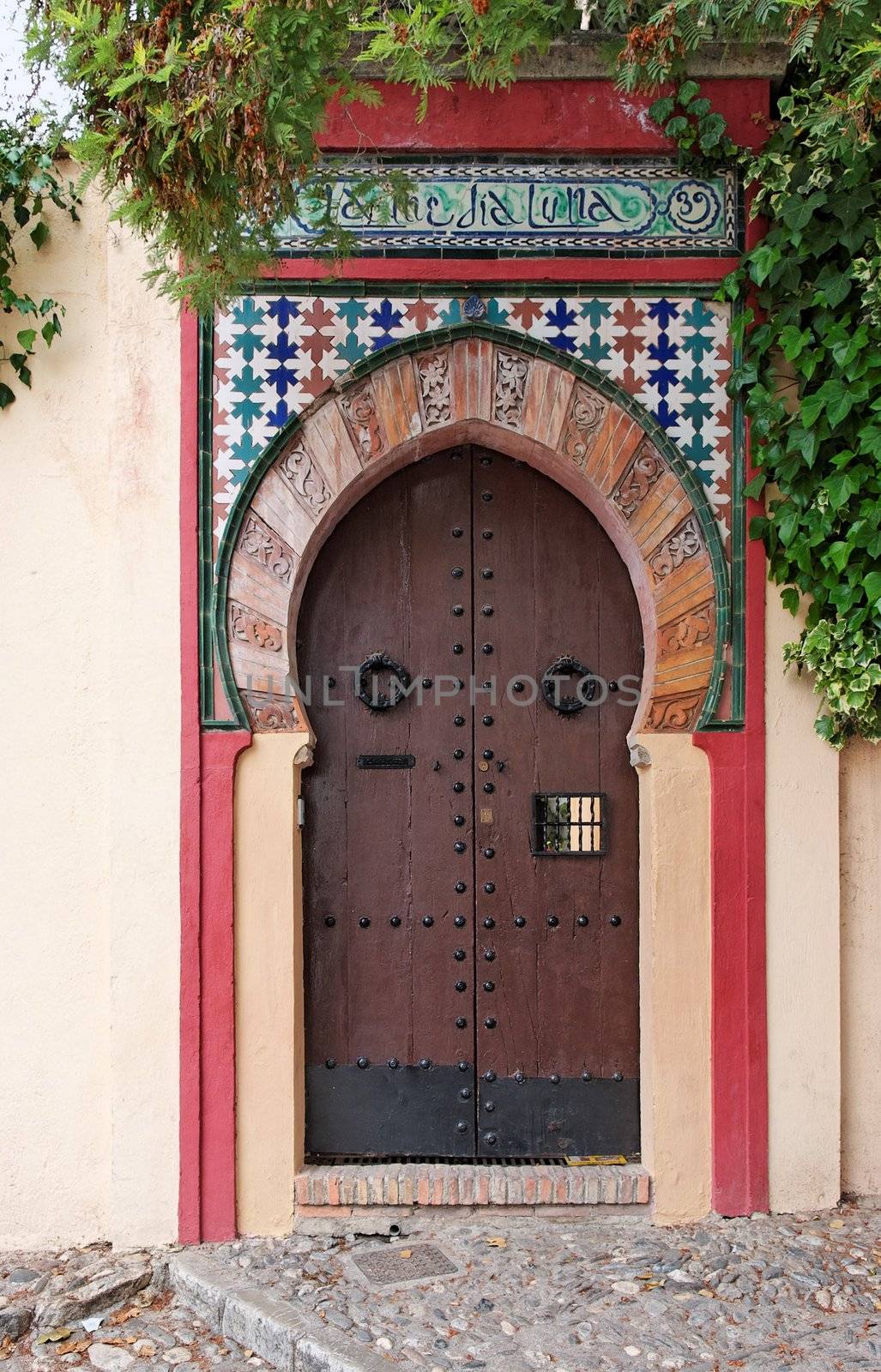 Moorish style door of a house in Granada, Spain