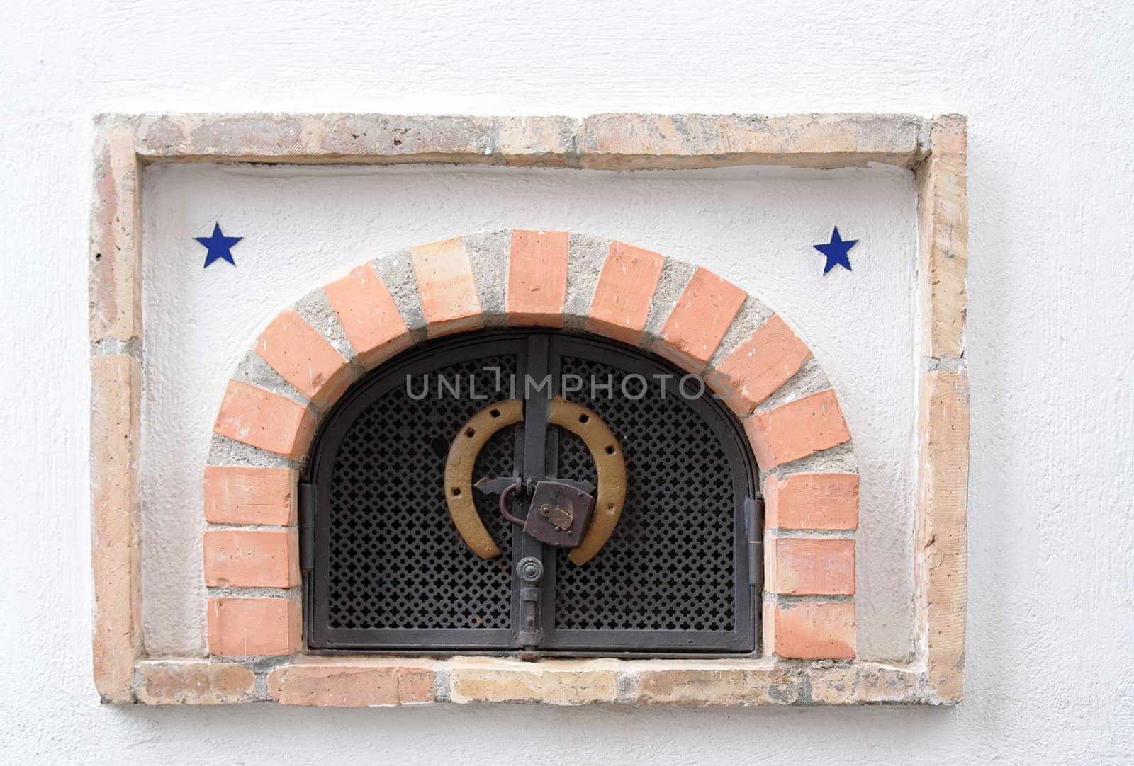 Small ventilation window with grate, padlock and horseshoe