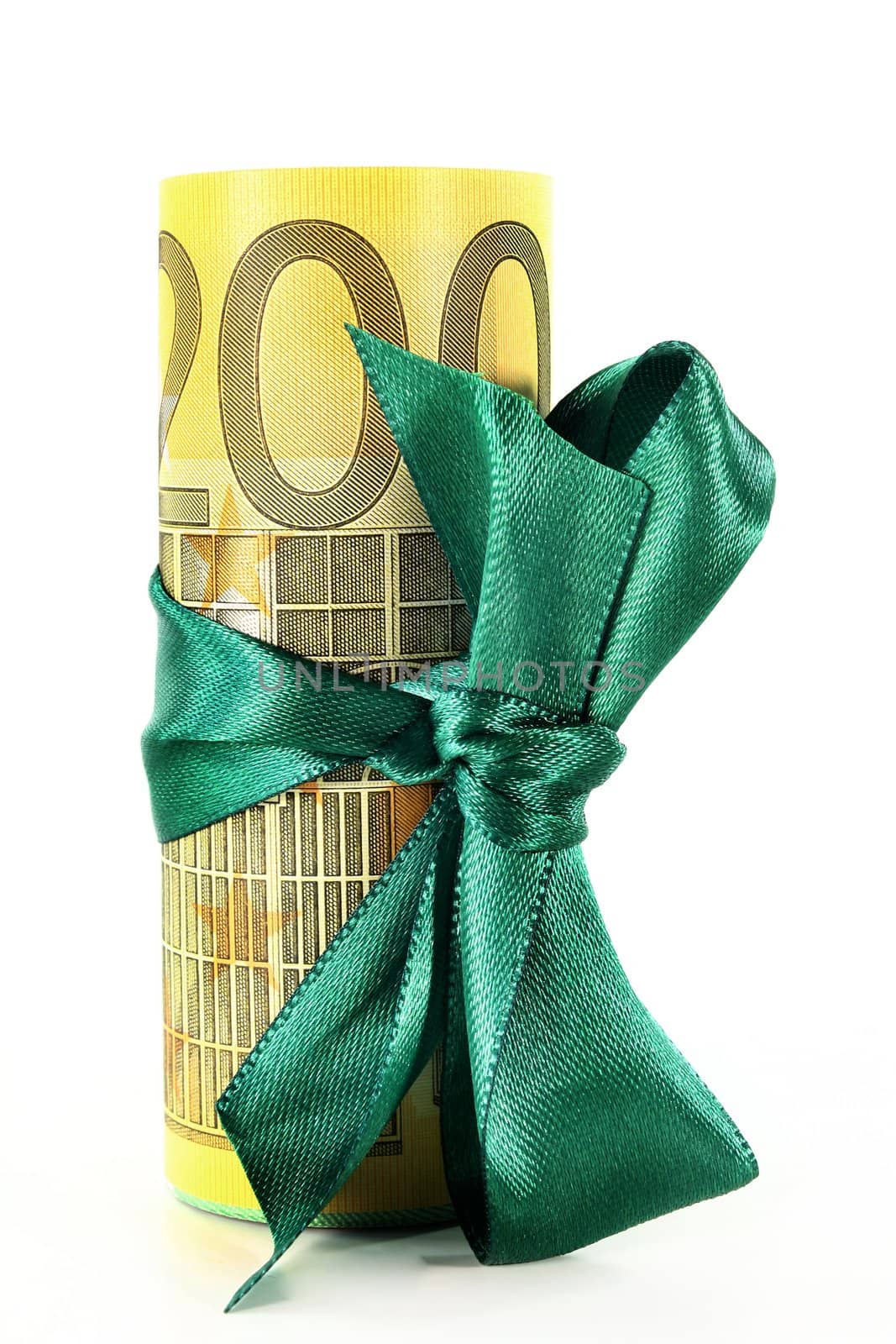 Rolled euro notes with a green ribbon