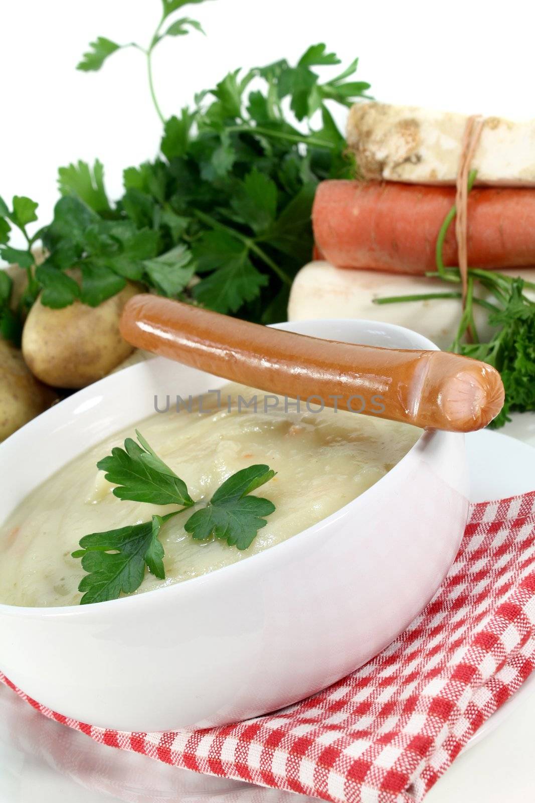 a bowl of potato soup with parsley