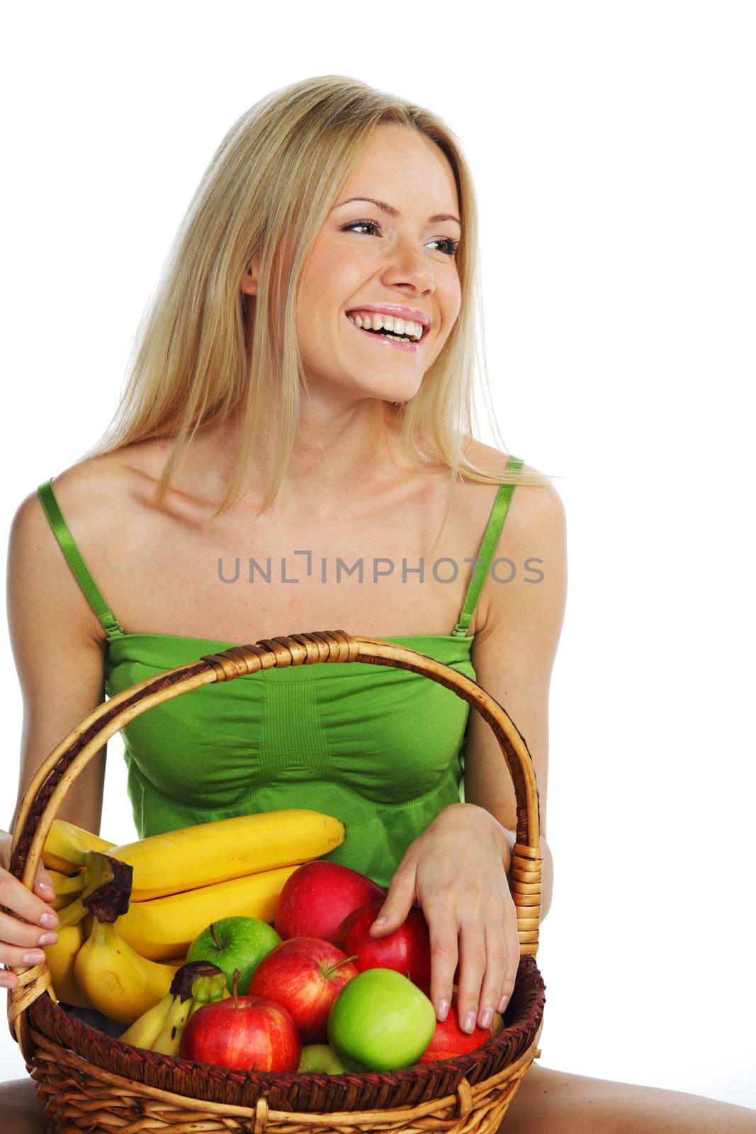 woman holds a basket of fruit on a white background