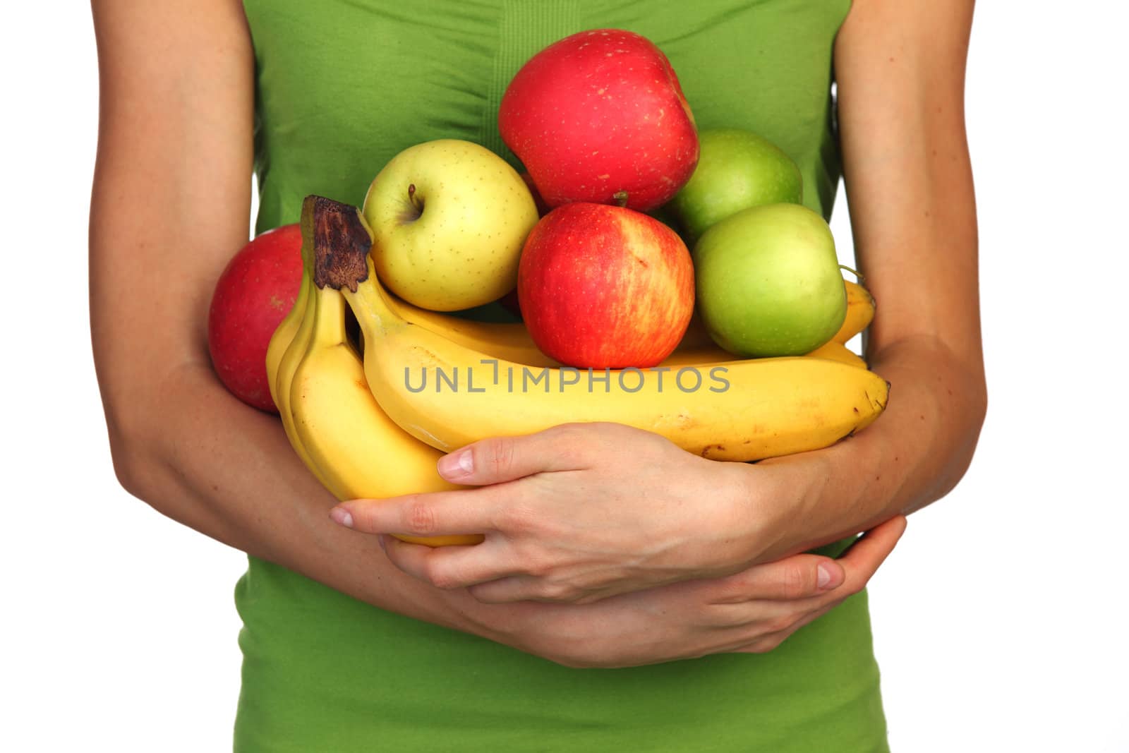 woman holds a pile of fruit on a white background