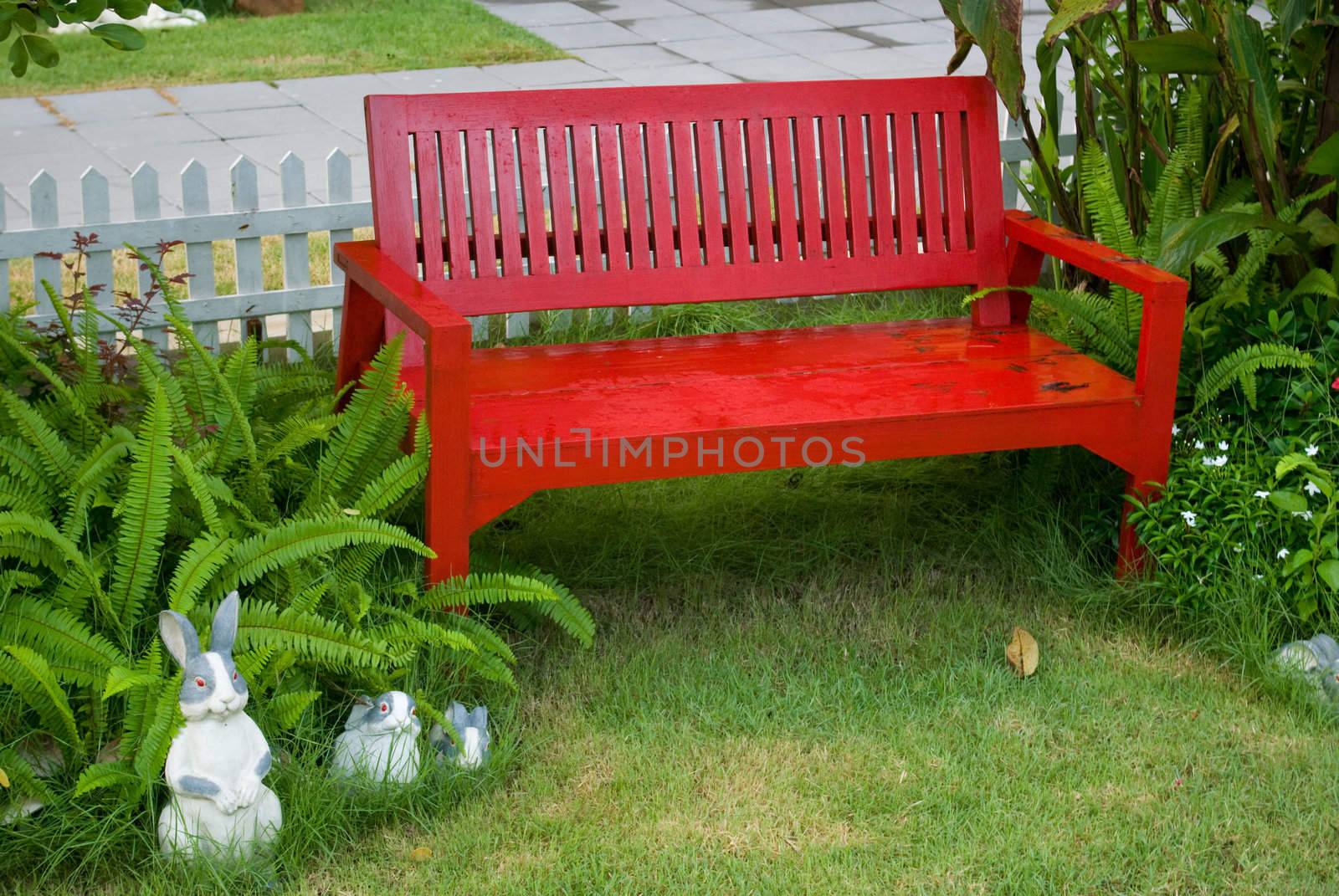 Red beach in the garden with tree