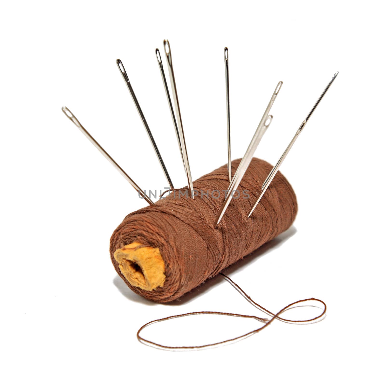 thread with needle on white background