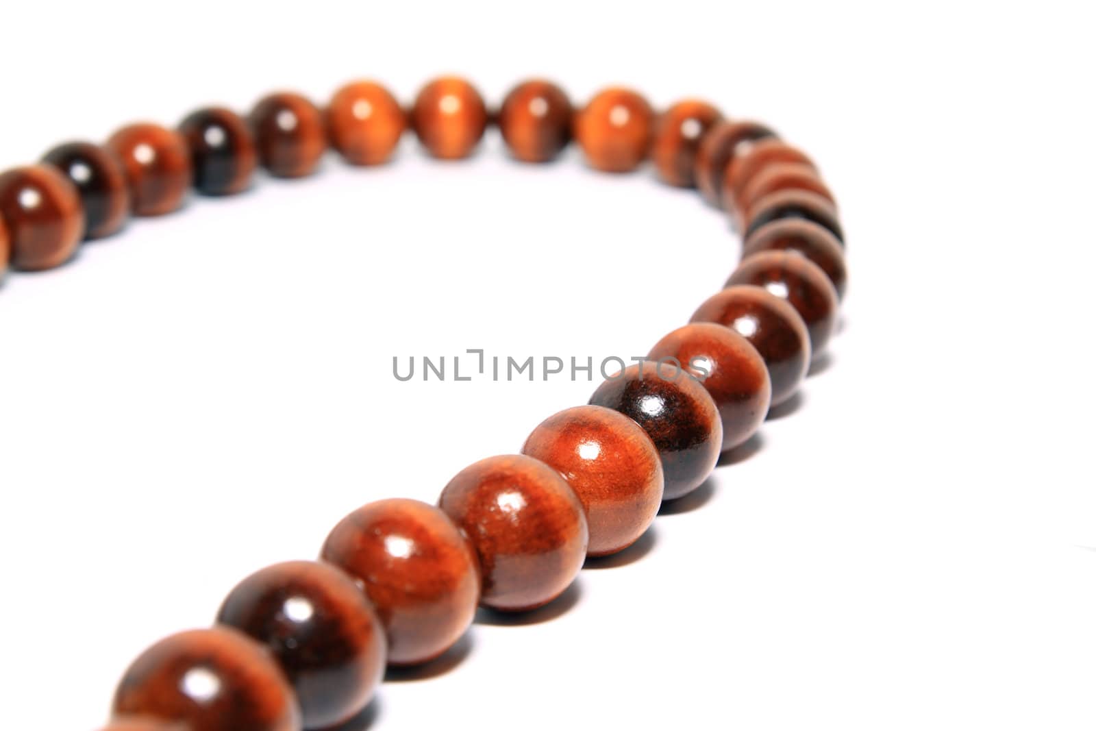 wooden necklace on white background