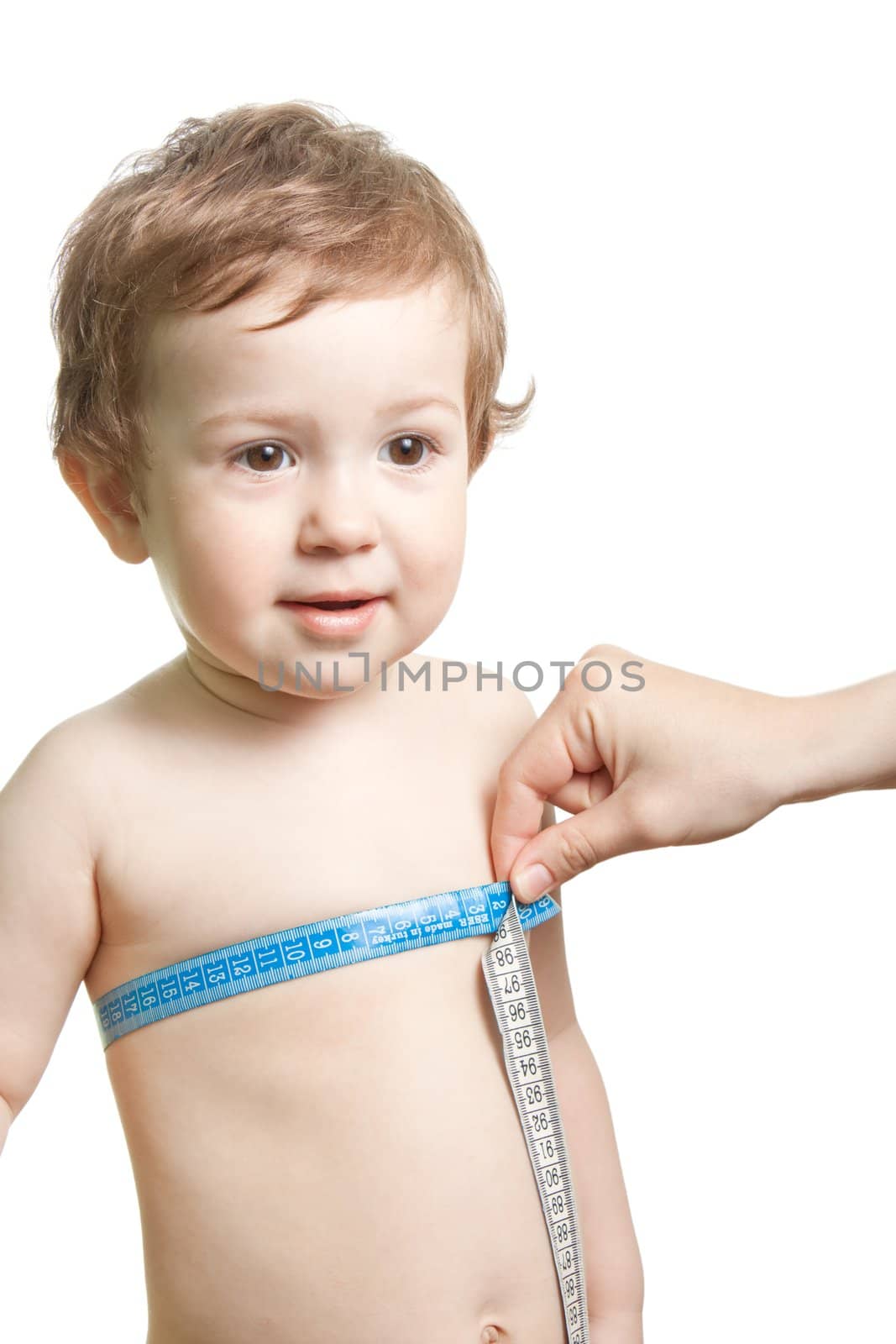 Measure tape in hand measuring human child chest