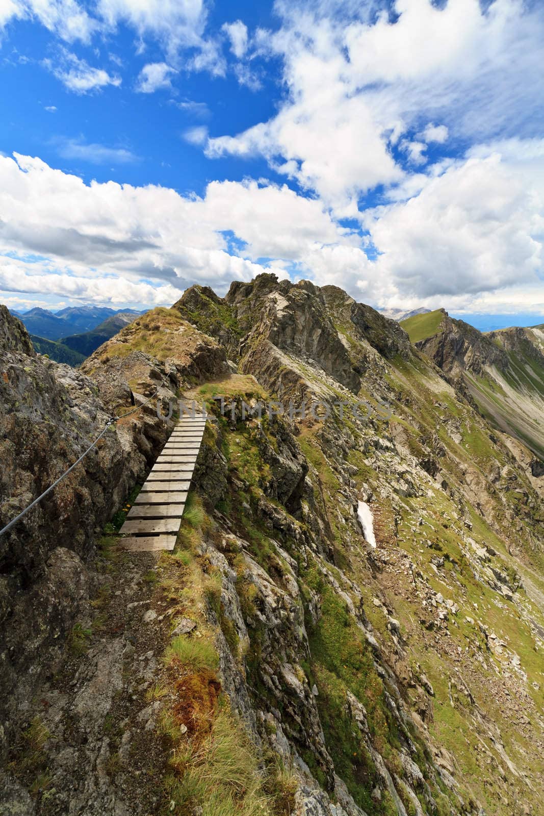 pathway with footbridge on Monzoni ridge, Italian Dolomites