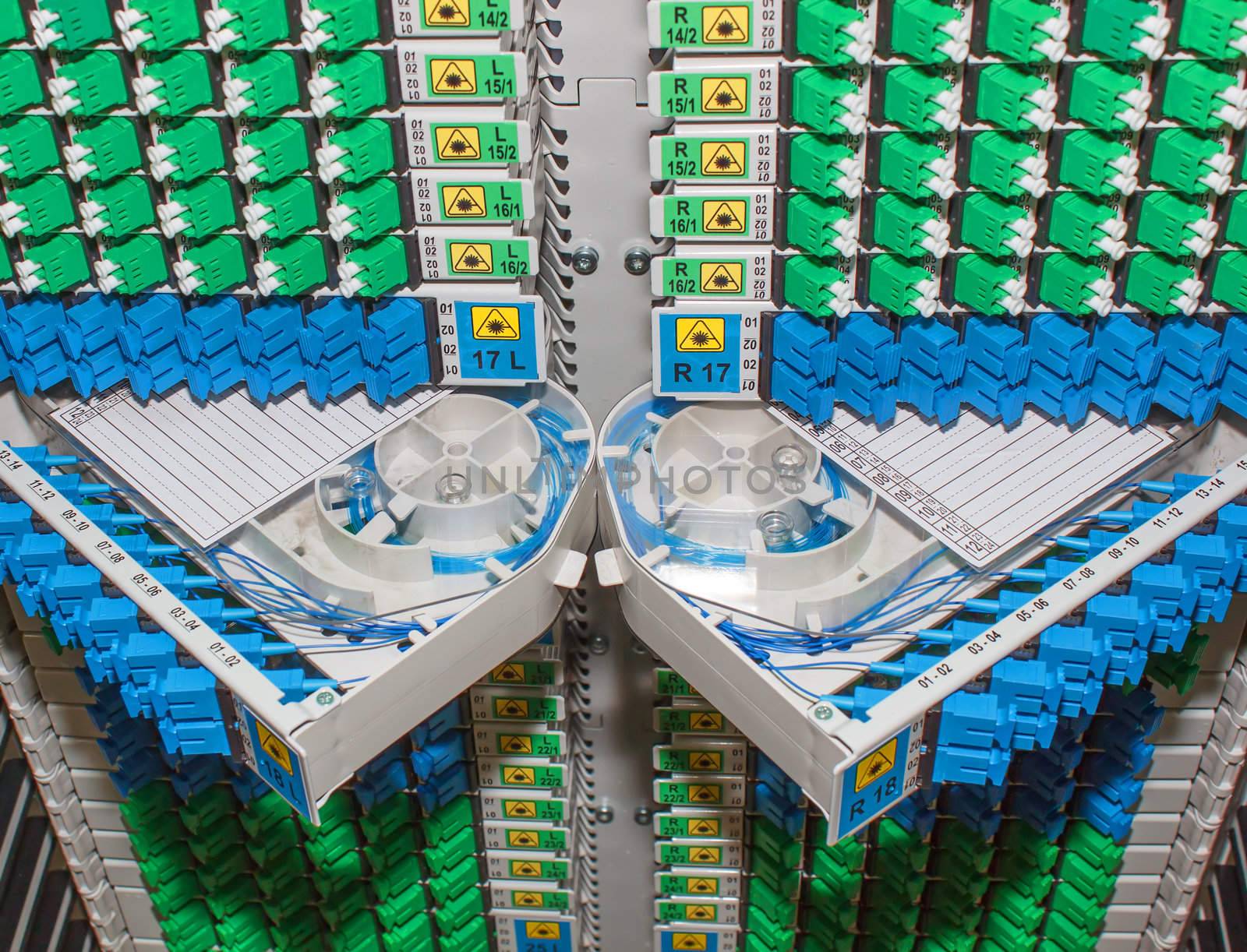 fiber optic rack with high density of blue and green SC connectors by artush