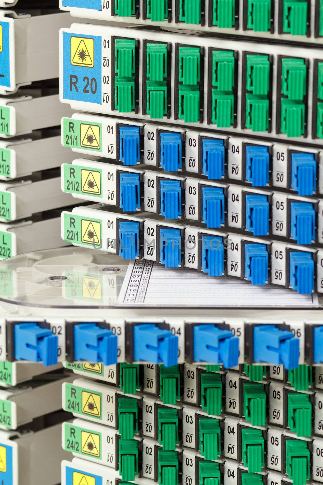 fiber optic rack with high density of blue and green SC connectors by artush