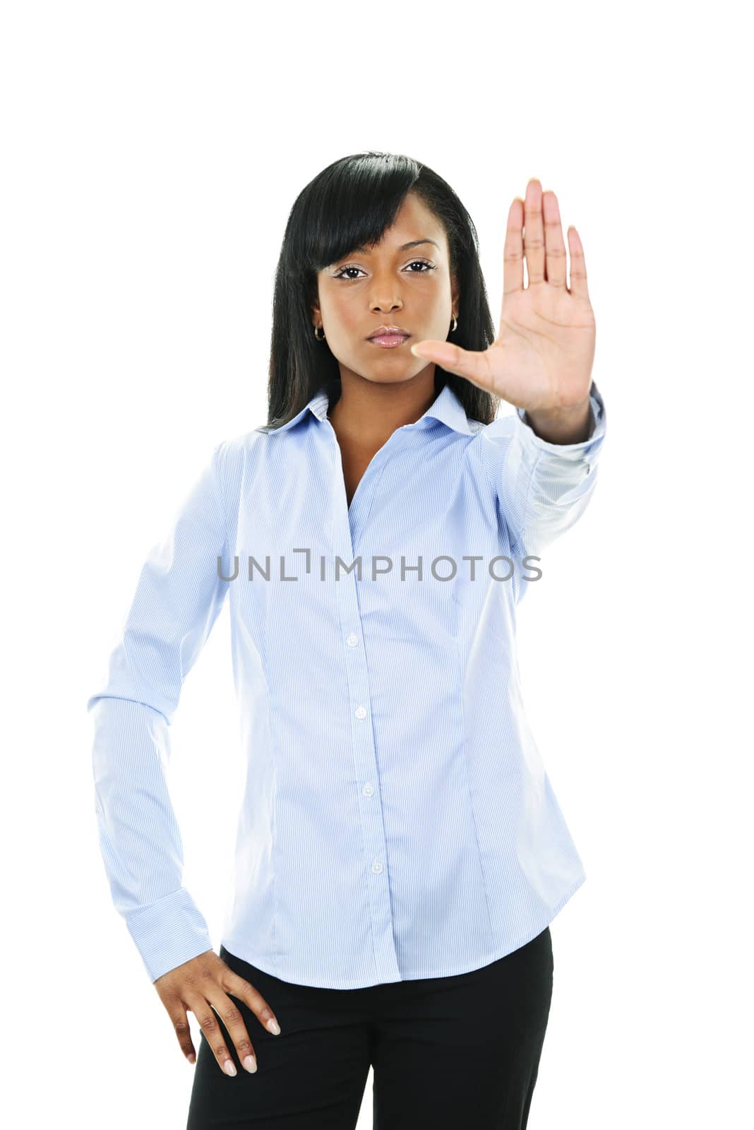 Serious black woman showing stop hand gesture isolated on white background