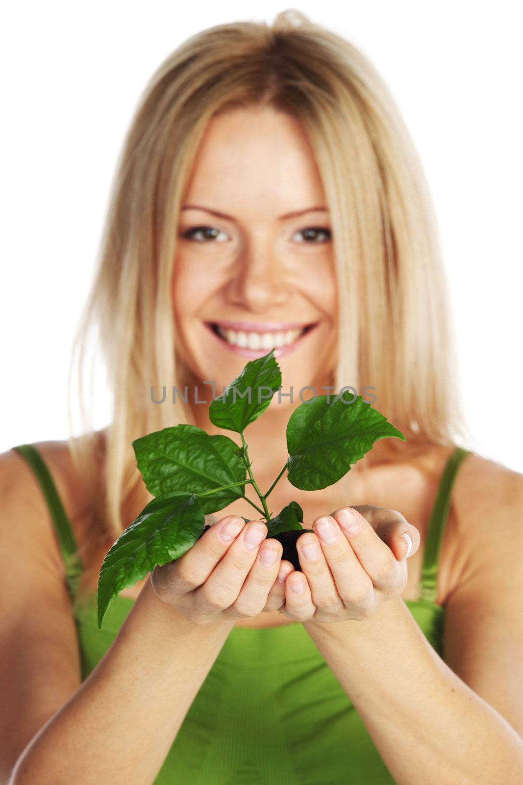 plant in blonde hands close up