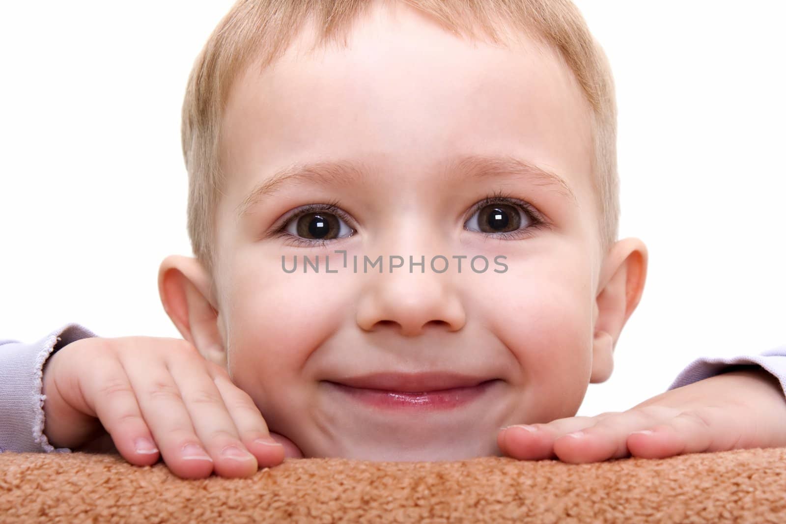 Little hiding child smiling for happiness and fun