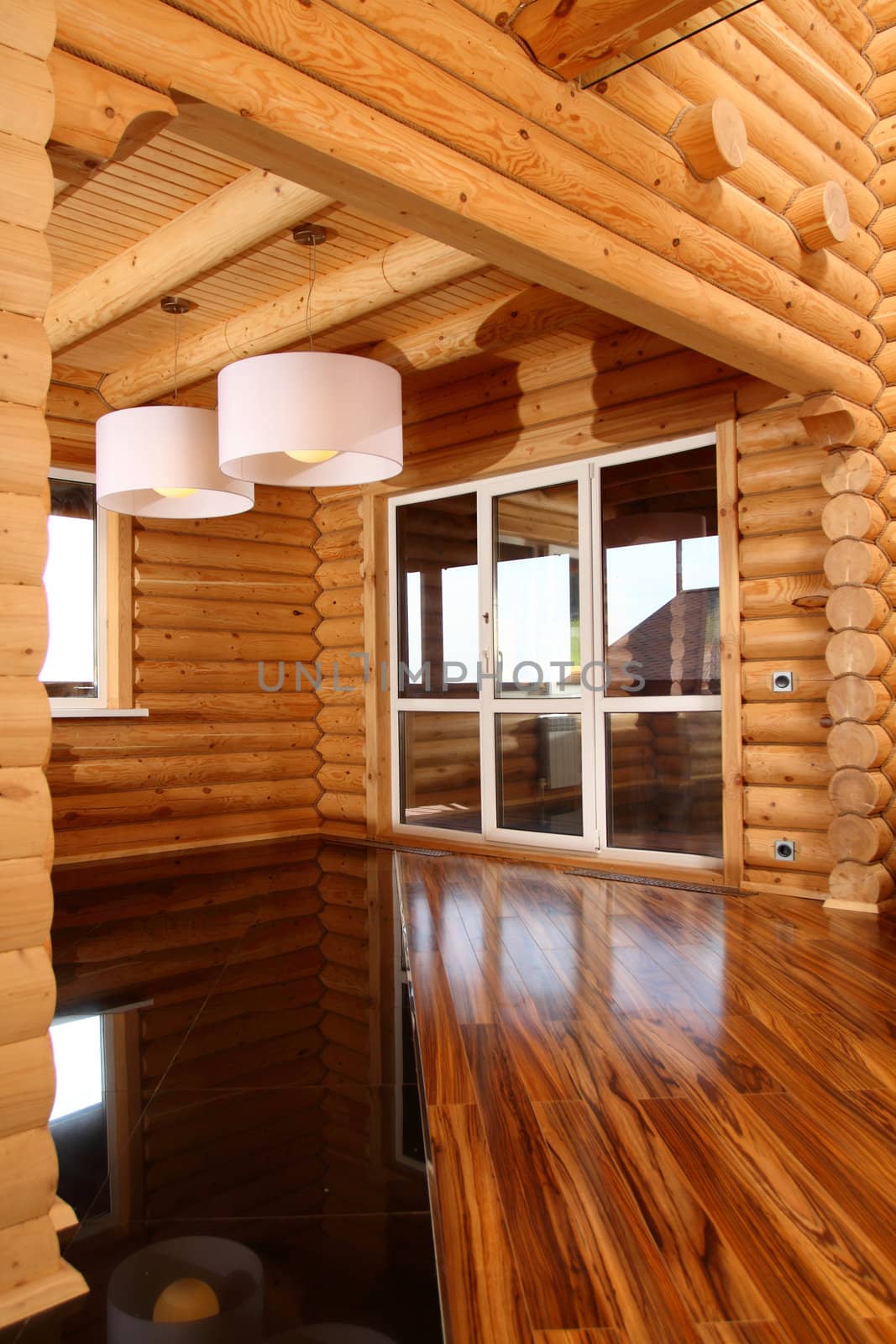 Spacious hall in the wooden house, executed in style hight-tech