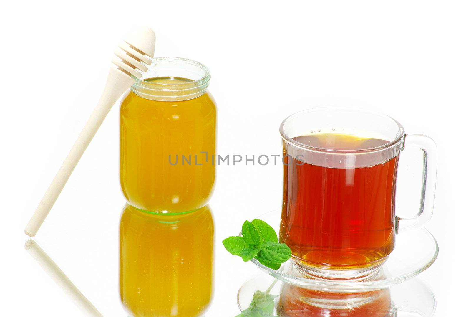 Tea being poured into glass tea cup