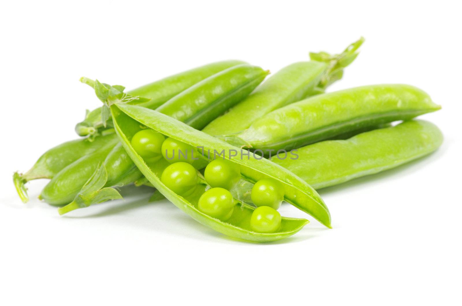 green peas vegetable closeup isolated on white