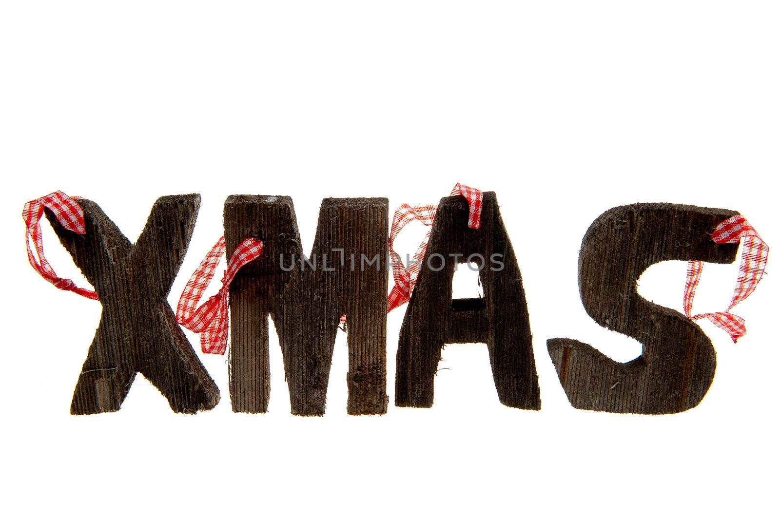 the word xmas in wooden letters