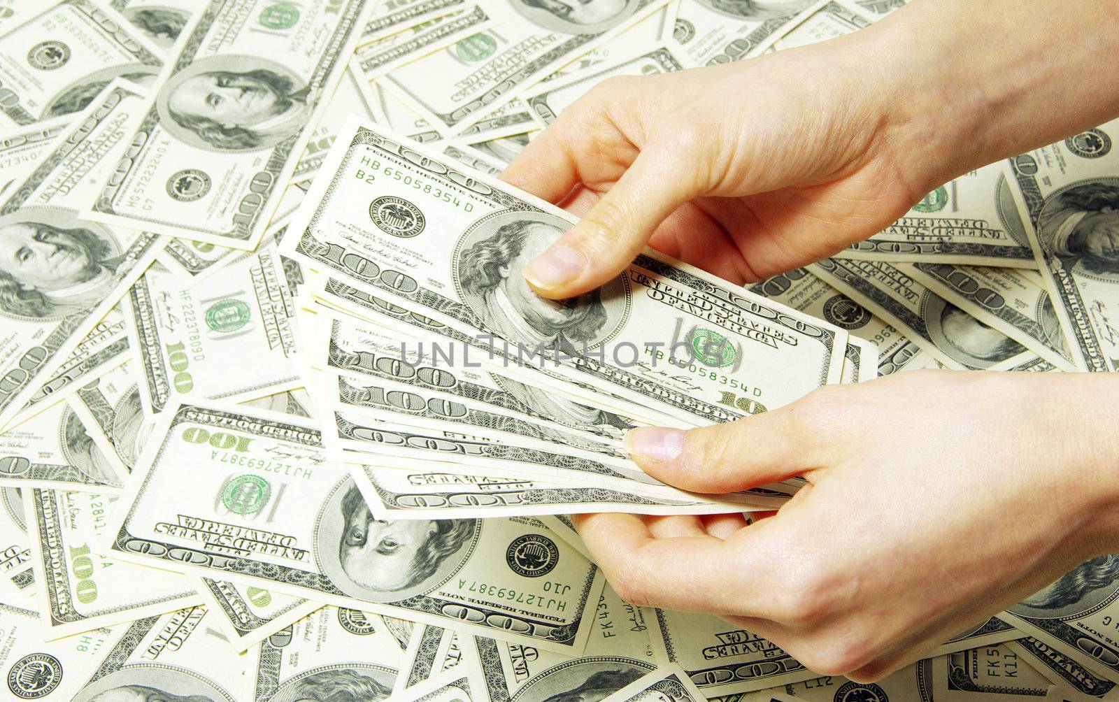 Hand with money isolated on money background
