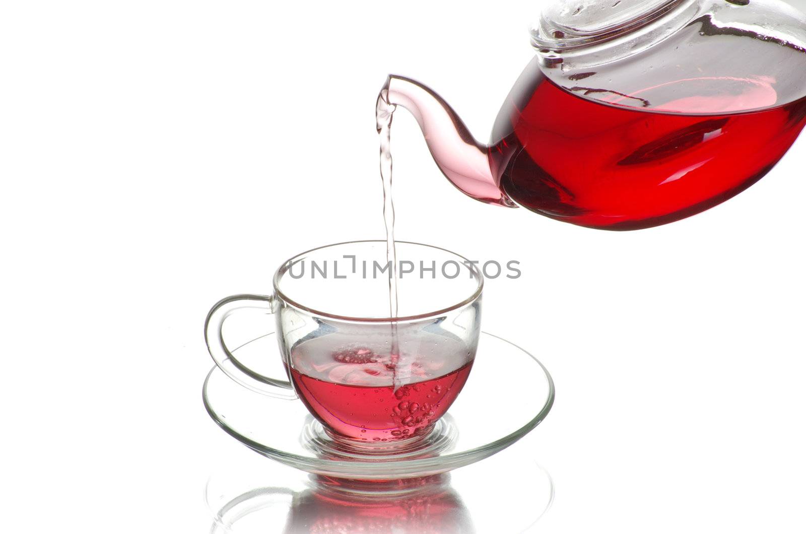 Tea being poured into glass tea cup