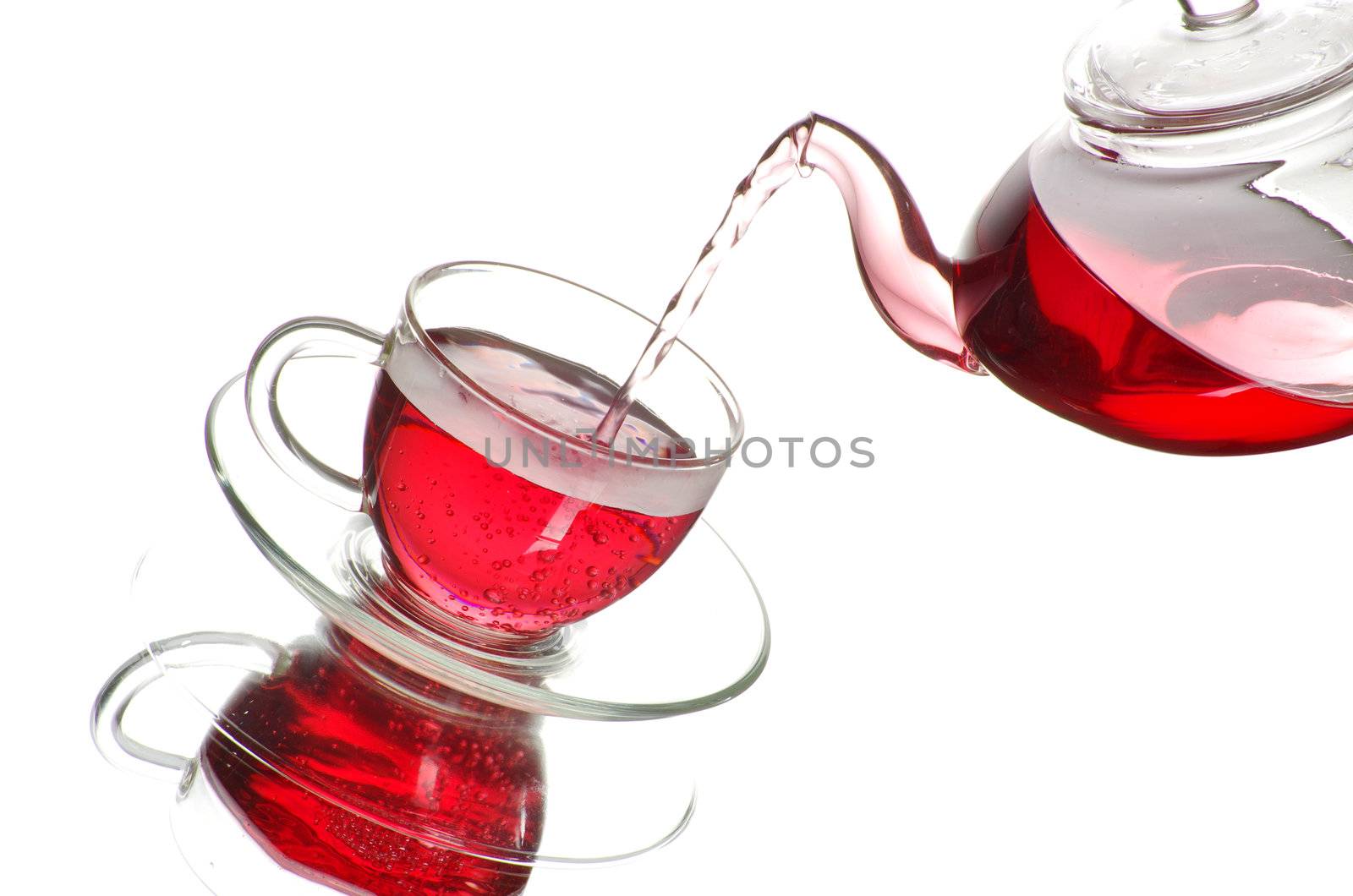 Tea being poured into glass tea cup