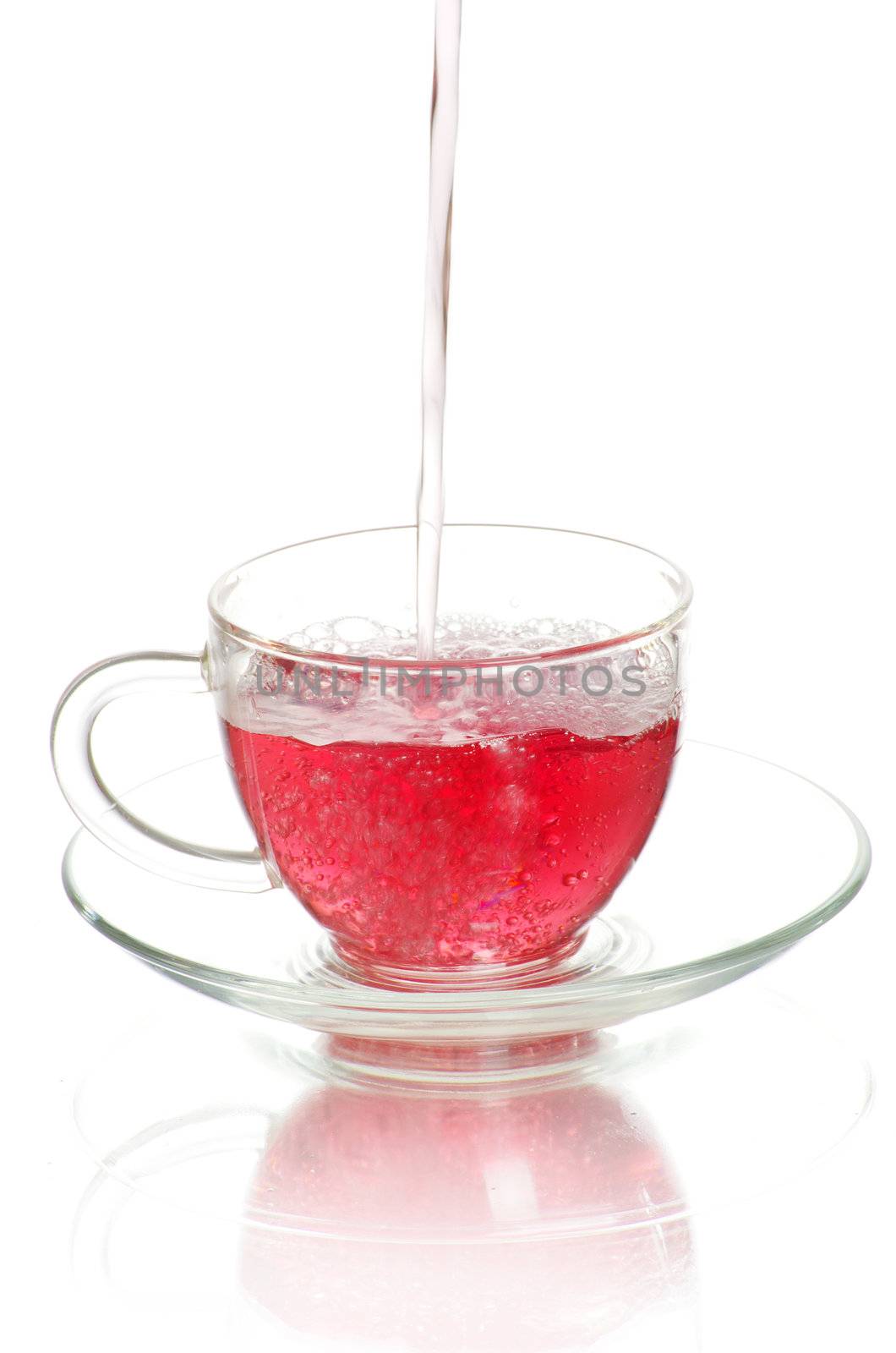 tea being poured into glass tea cup