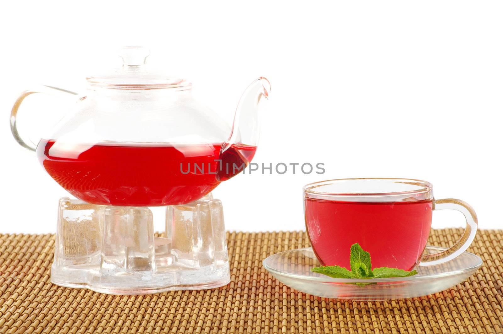 Tea being poured into glass tea cup