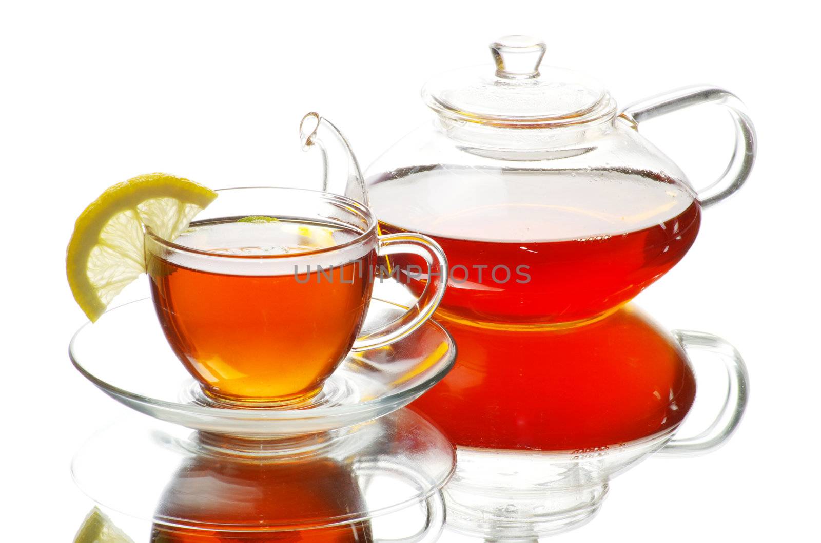 Tea being poured into glass tea cup
