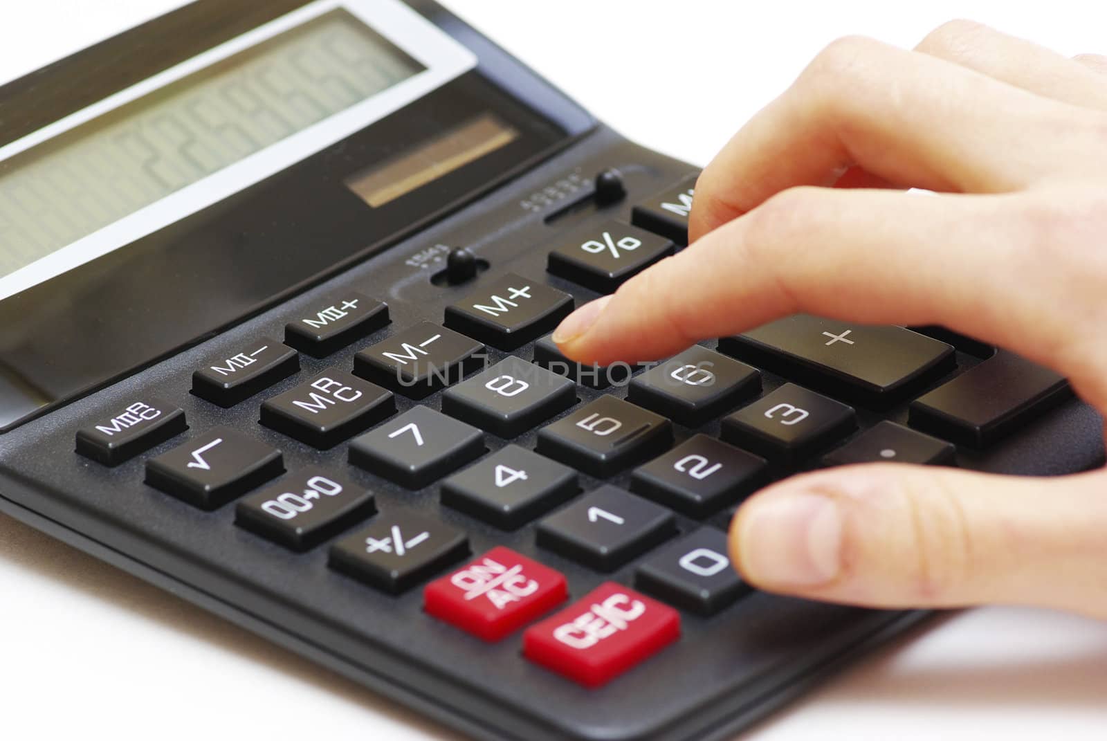 calculator with hand isolated on white