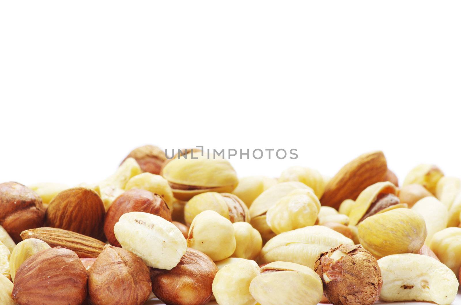 Assorted mixed nuts on white background