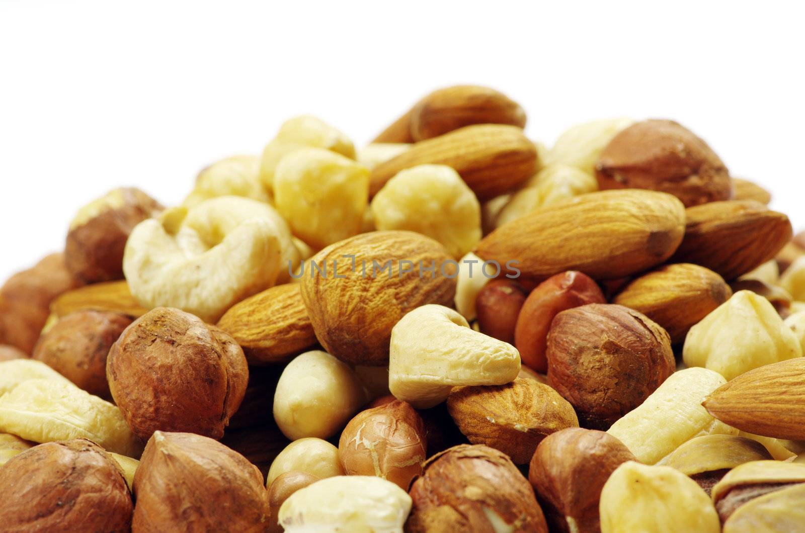 Assorted mixed nuts on white background