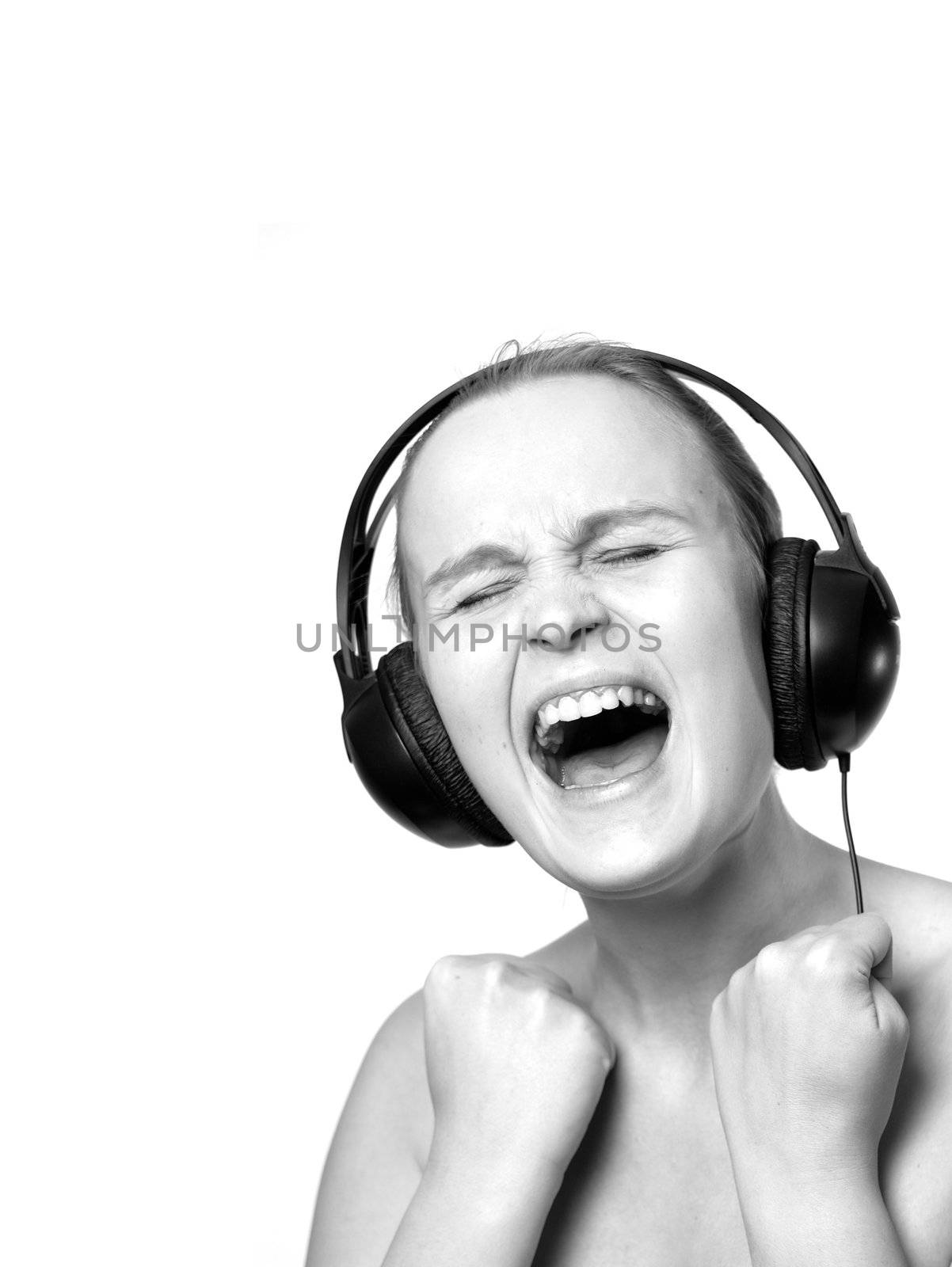 Girl in phoneheads is crying emotionally, isolated on white with extra copyspace for text, black&white.