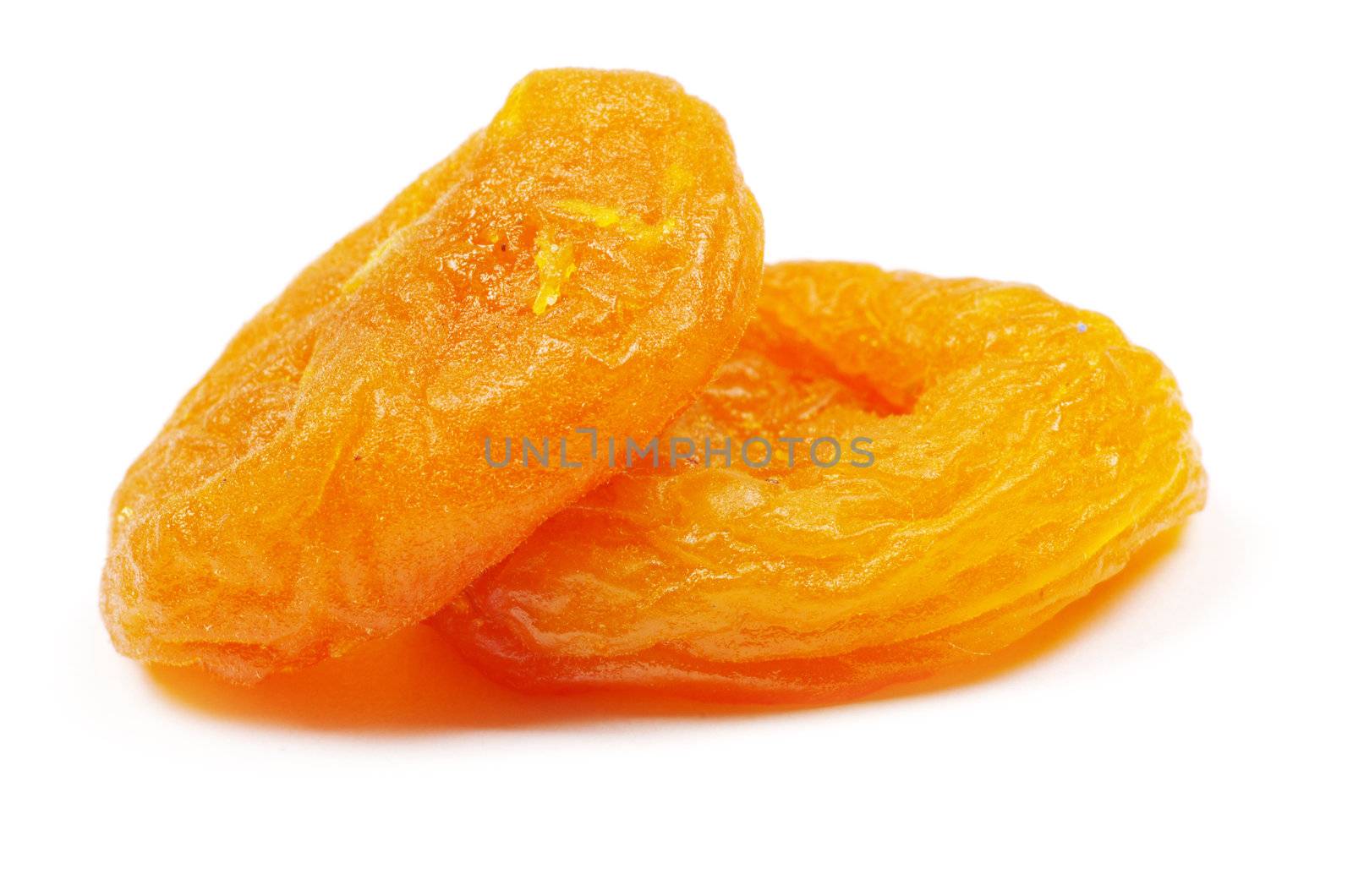 heap of dried apricots over white