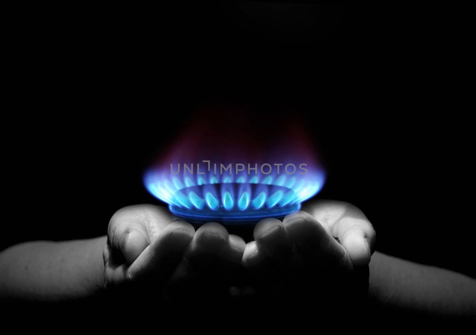 Hands holding a flame gas