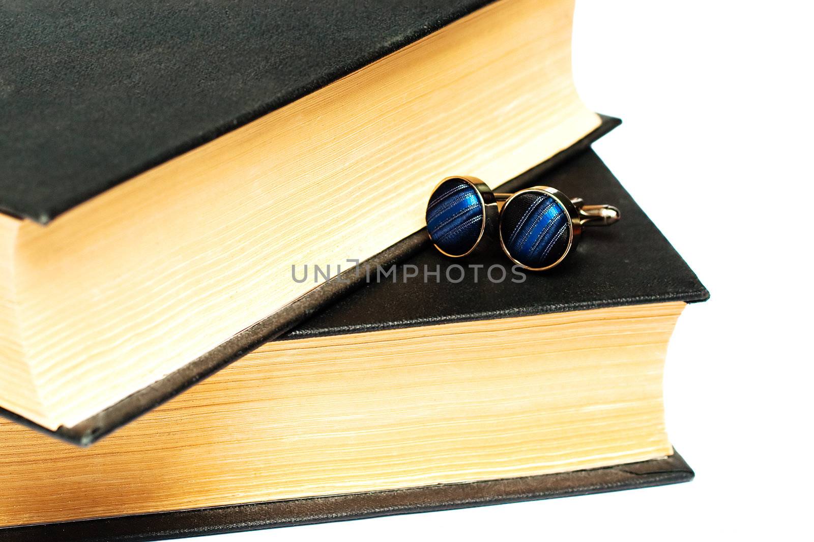 Cufflinks lying on the book, were once very popular