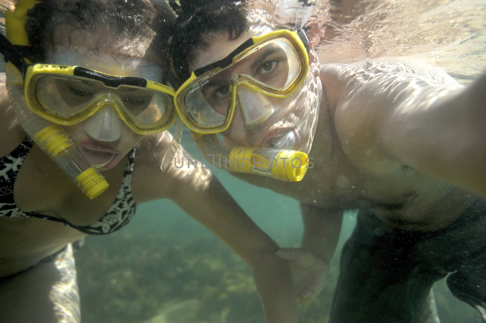 Scuba diving with underwater view.