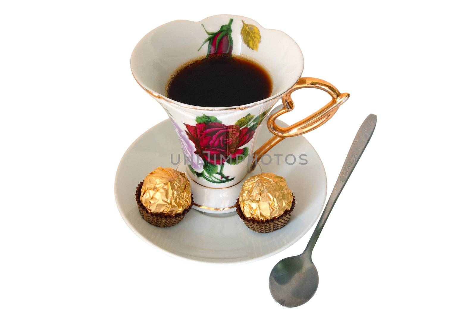 Old china cup of tea (or coffee) and sweeties on isolated background.