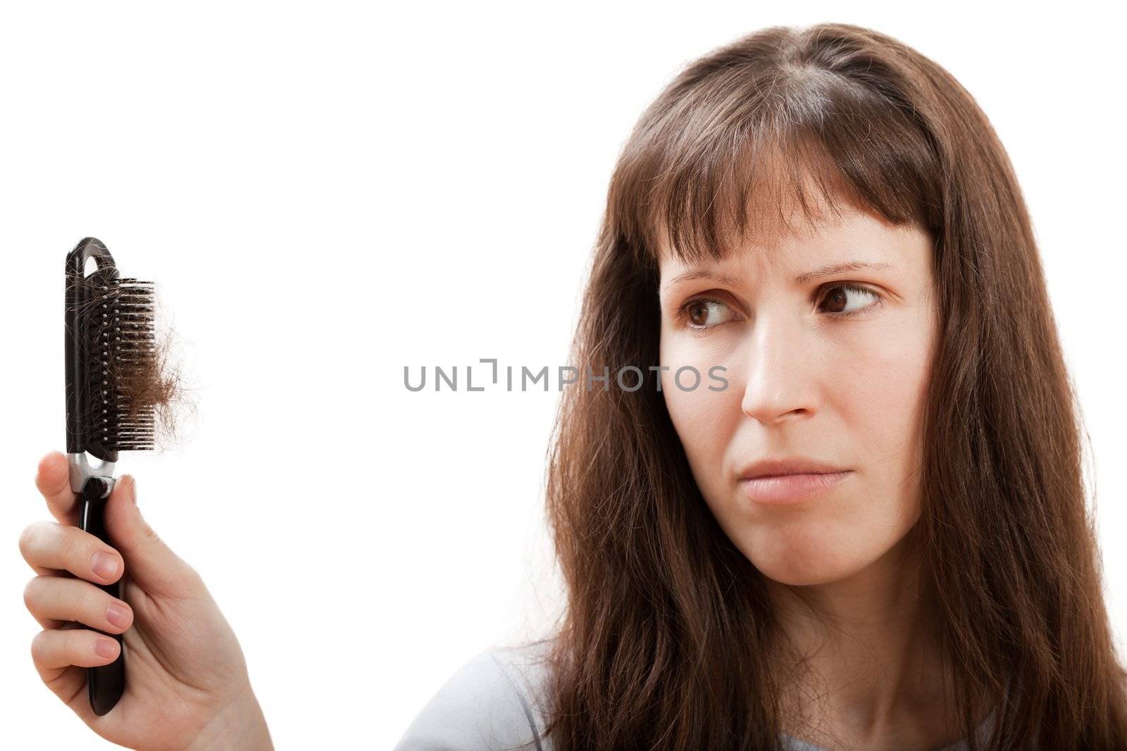 Loss hair comb in women hand by ia_64