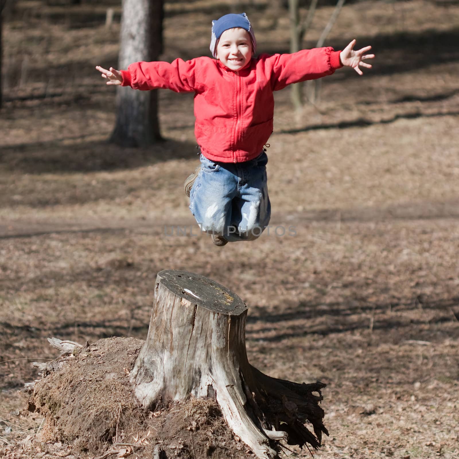 Fun jump - little sport child high jumping up long