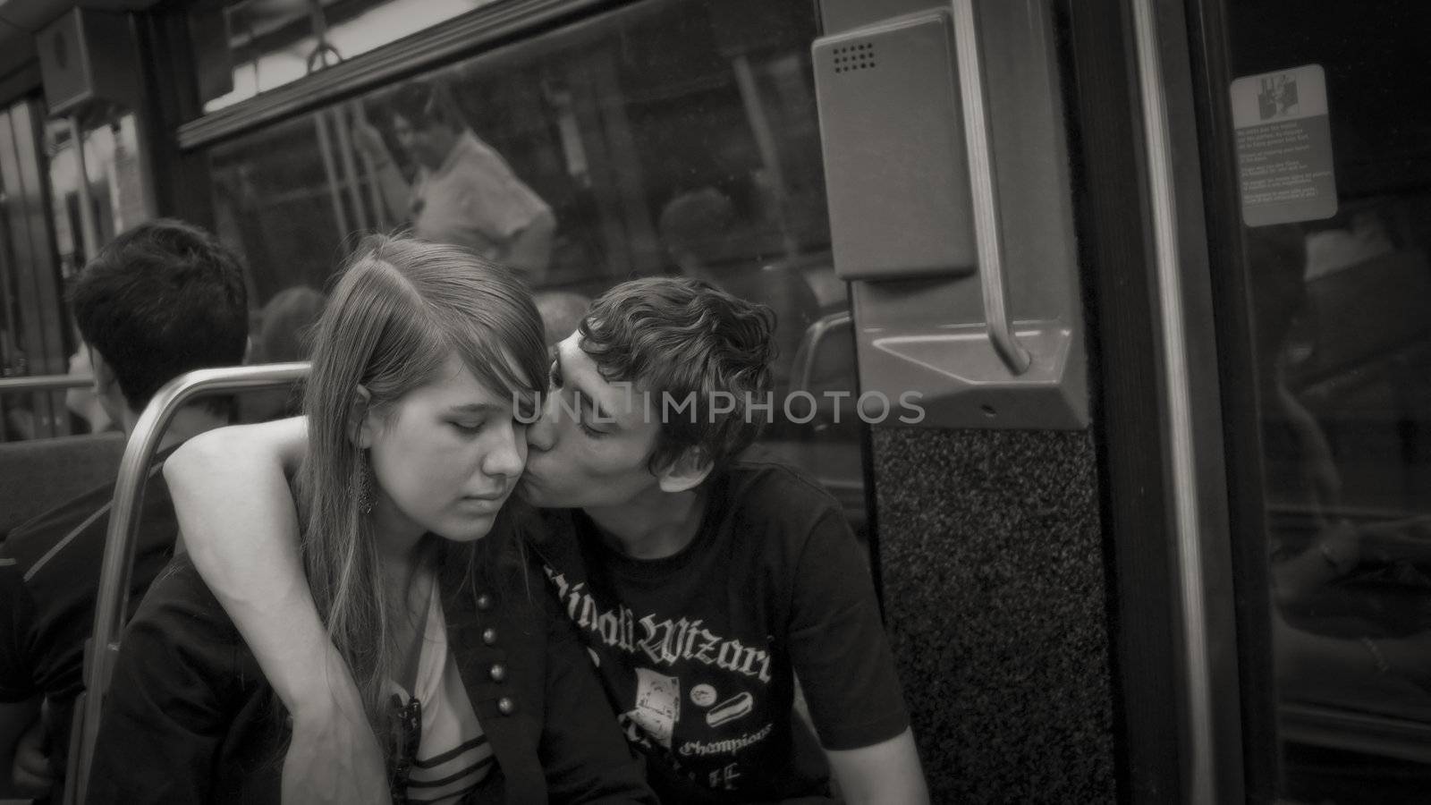 I LOVE YOU MY DEAR, PARIS, FRANCE - APRIL 24, 2011: Young couple in love enjoying themselves in the Metro of Paris. Monochrome image.
