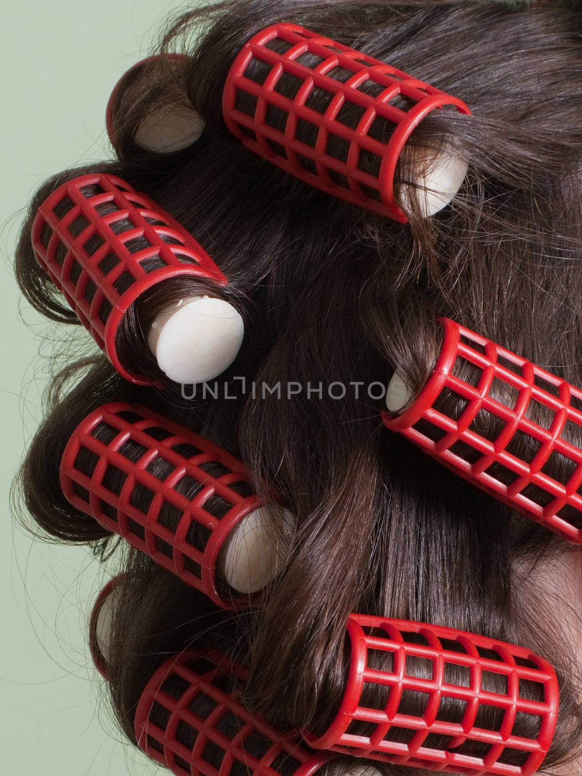 Curlers hair roller on adult beauty women