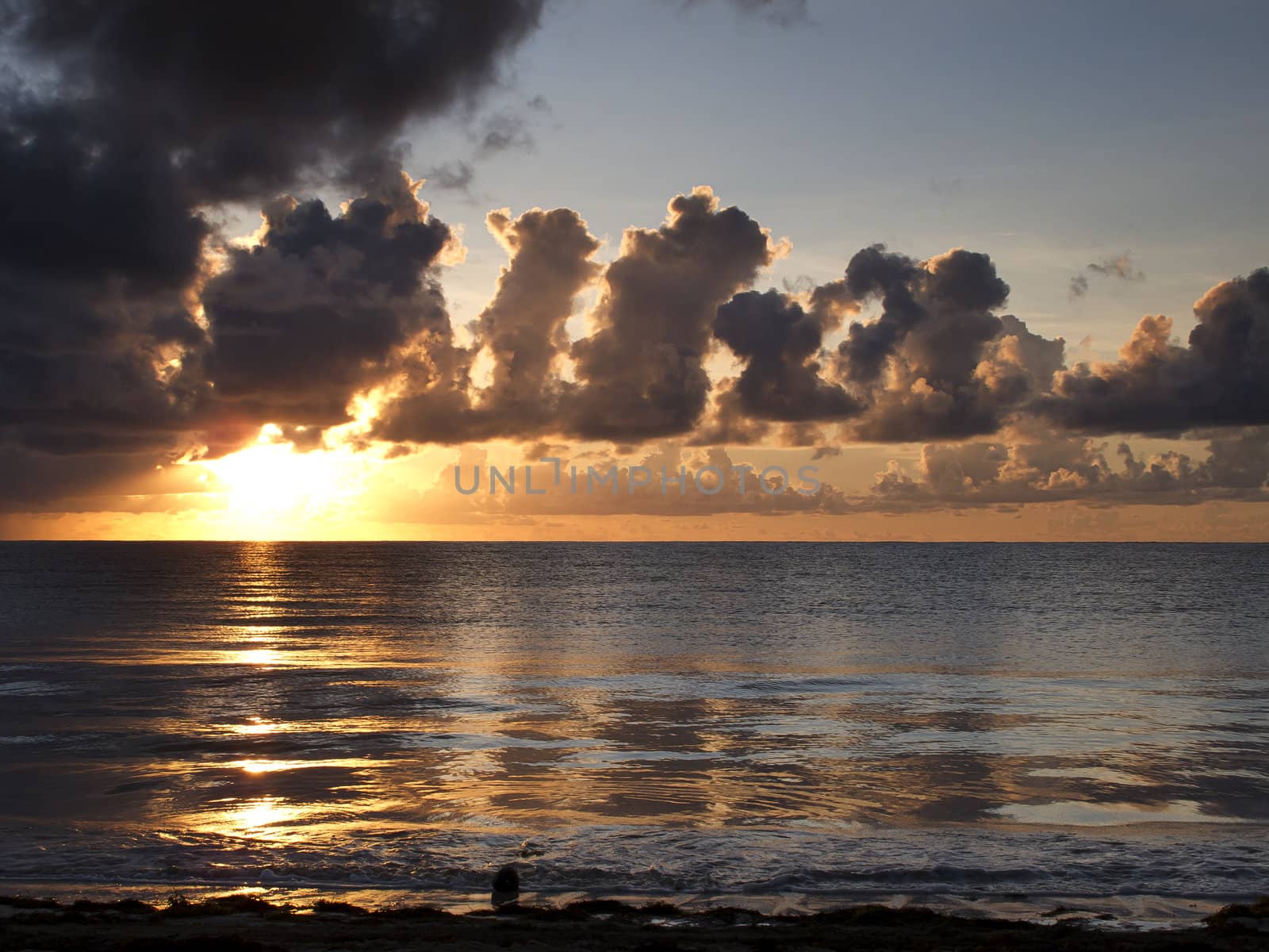 View of a sunrise, on a cloudy day, over the atlantic ocean