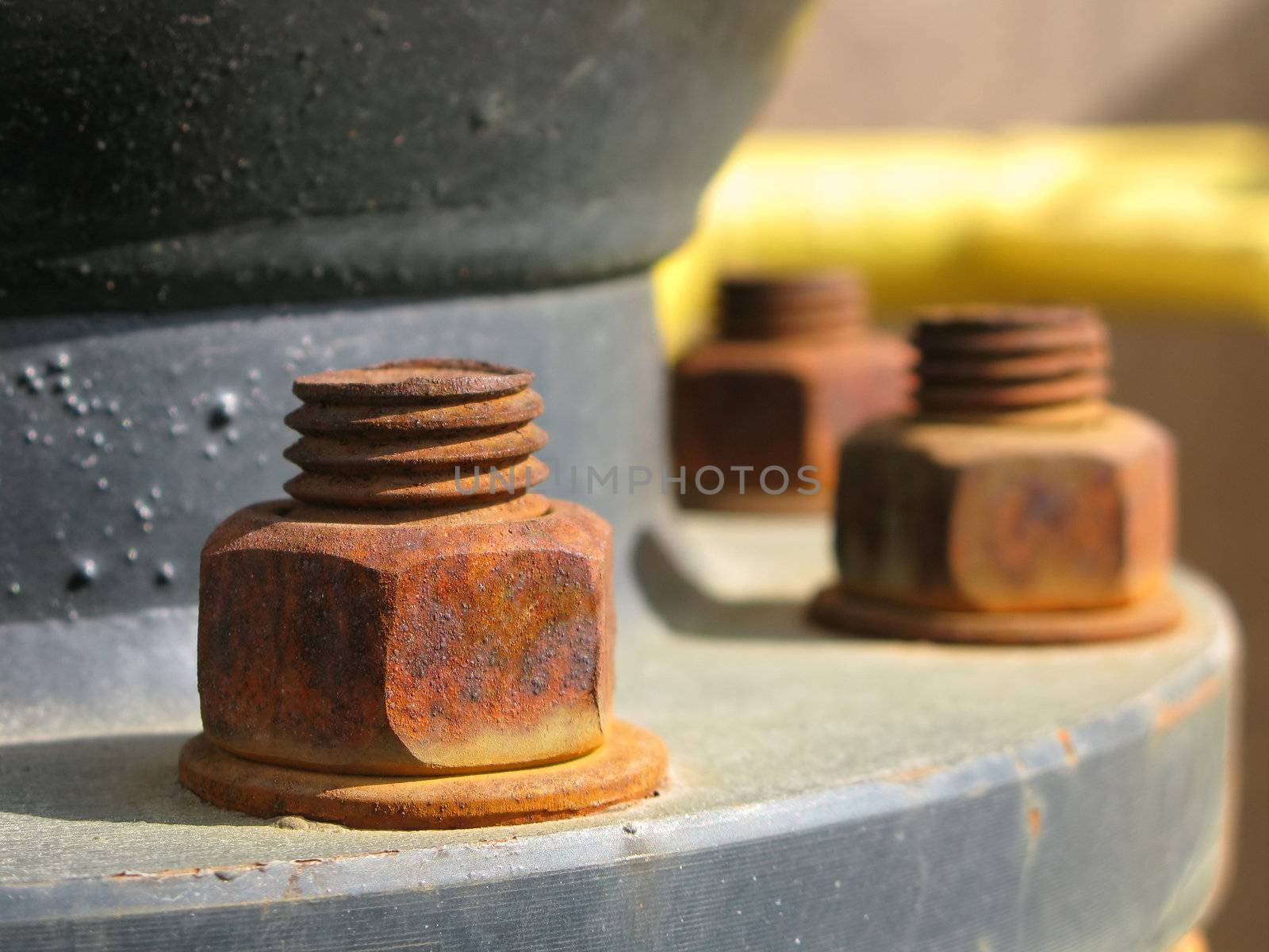 Old rusty metal nut on iron water valve by ia_64