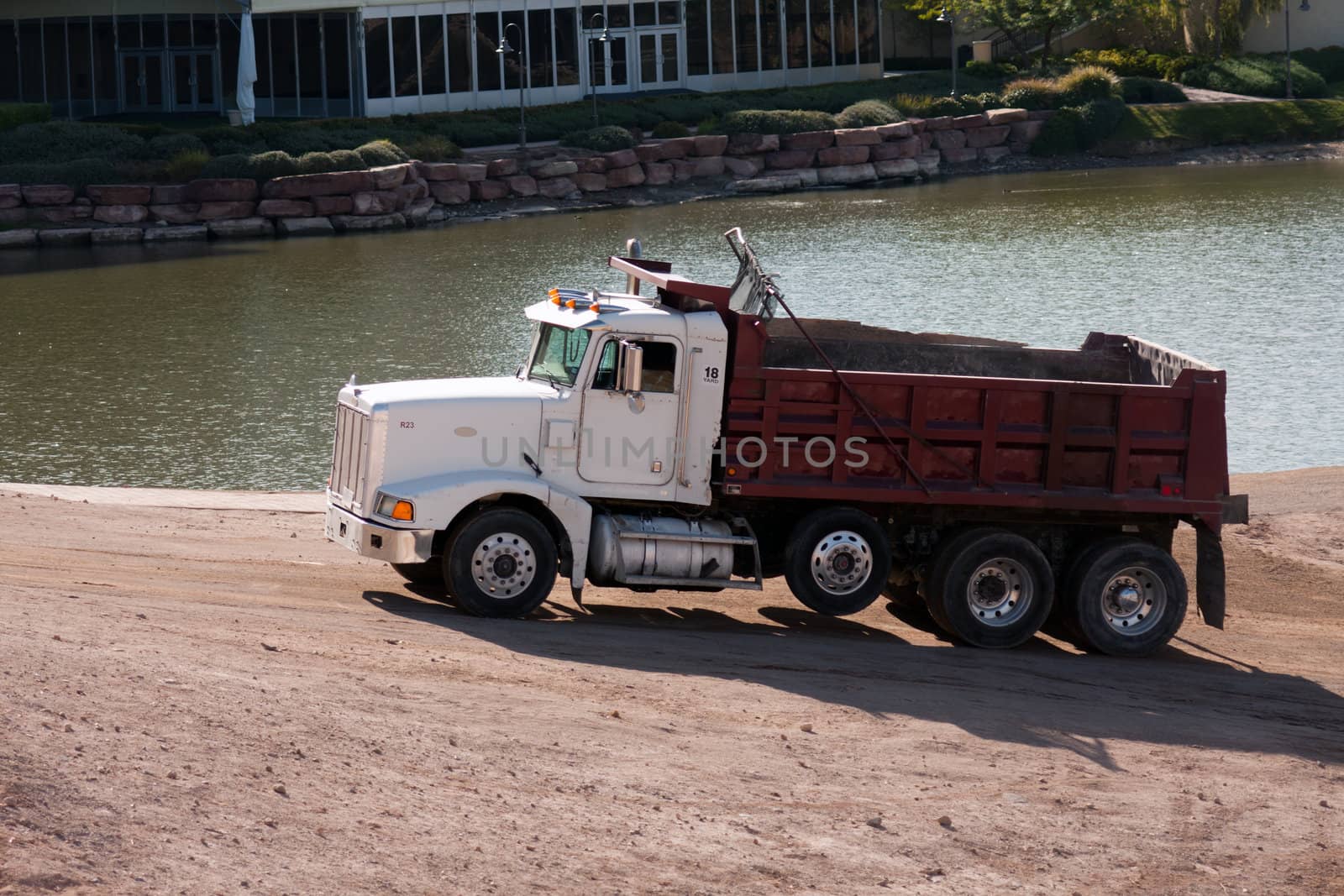 sand gravel truck hauling load from lake